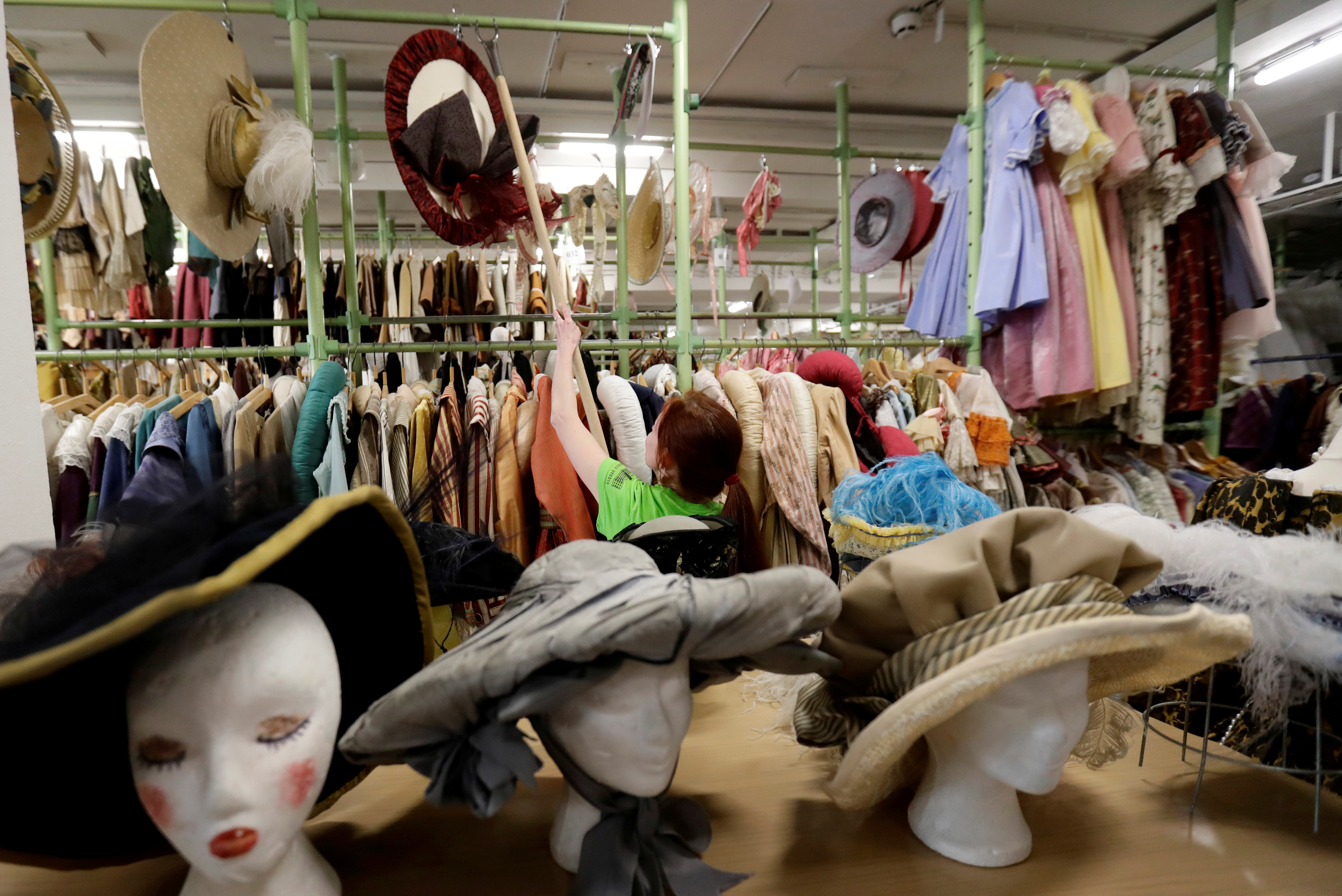 An employee works in a costume and props storage of the Barrandov Studio in Prague