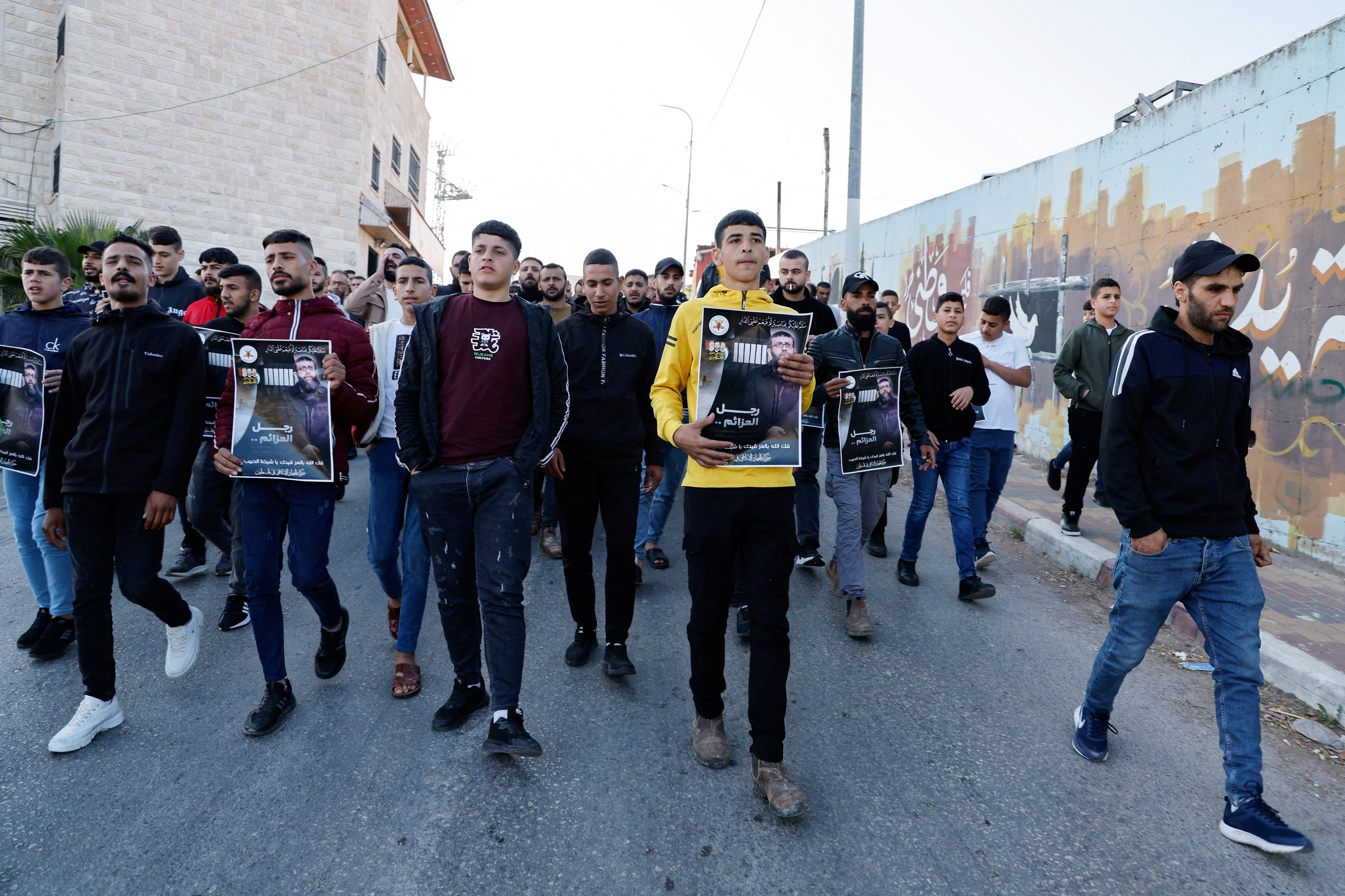 Palestinians gather at the house of Palestinian prisoner Khader Adnan near Jenin