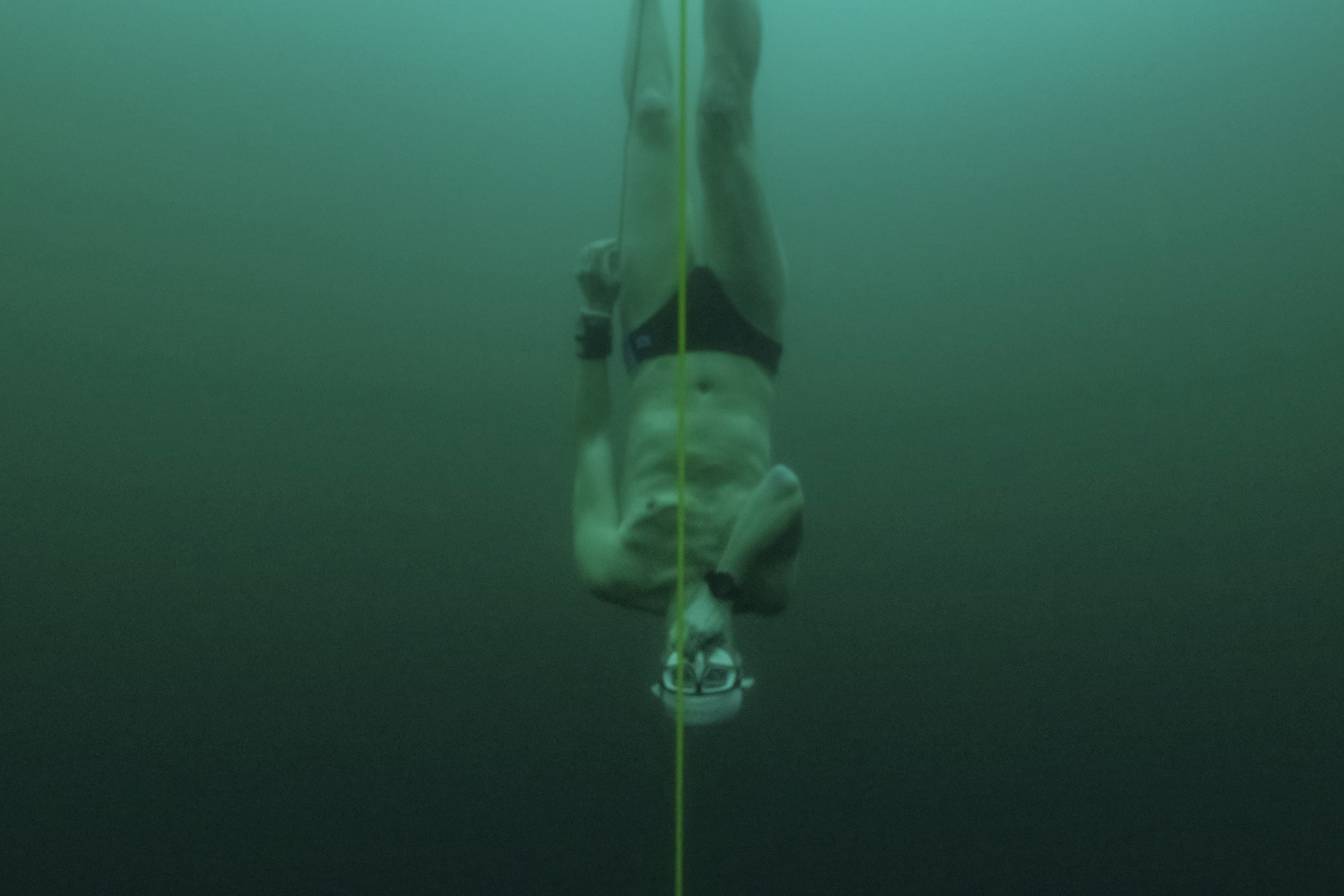 Czech freediver Vencl dives to 52 metres under the ice in Sils