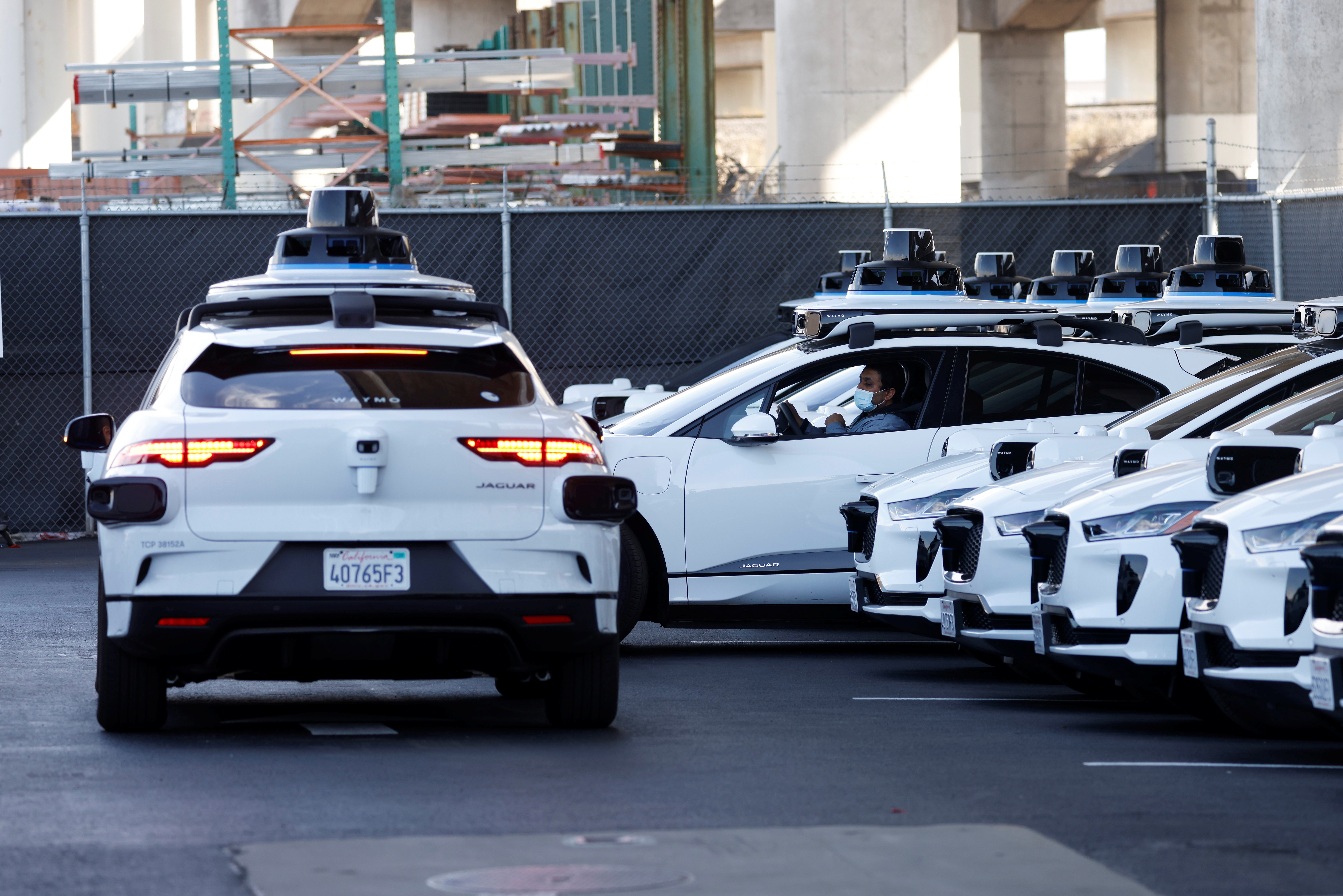 Jaguar I-Pace electric vehicles are tested at Waymo's operations center in San Francisco