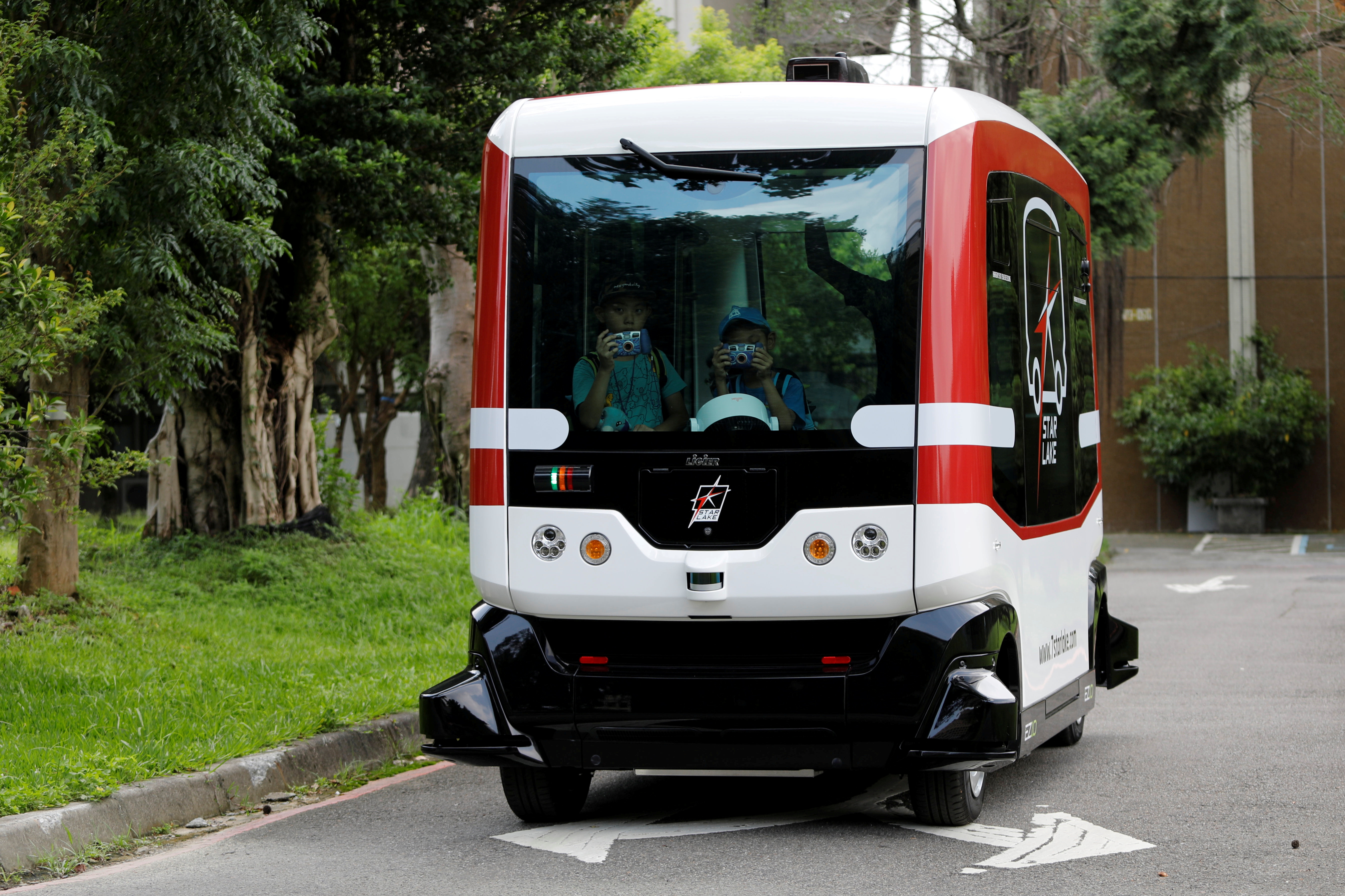 French-made 'EZ10' autonomous bus, also known as a driverless vehicle, runs at university campus in Taipei