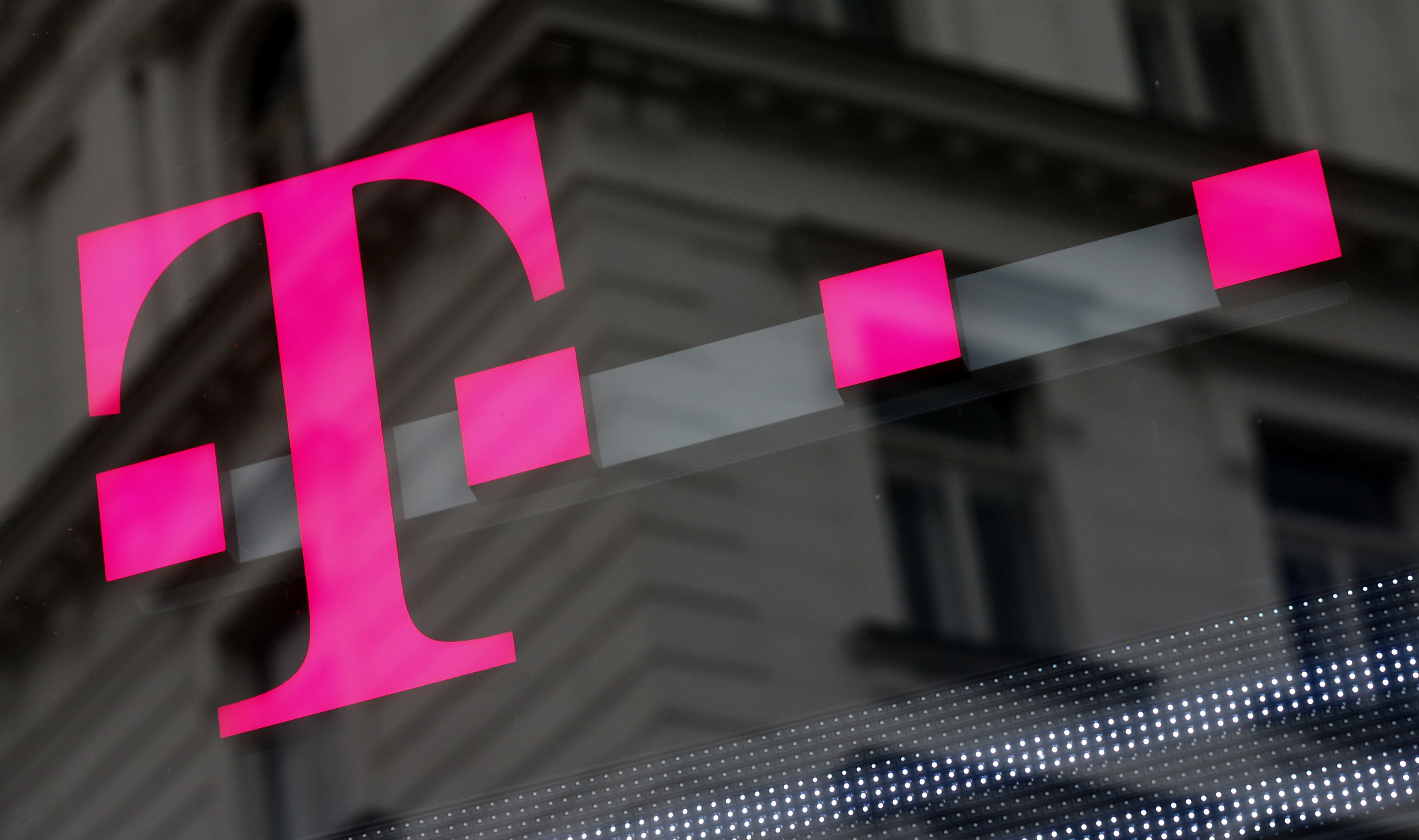 The logo of T-Mobile Austria is seen outside of one of its shops in Vienna