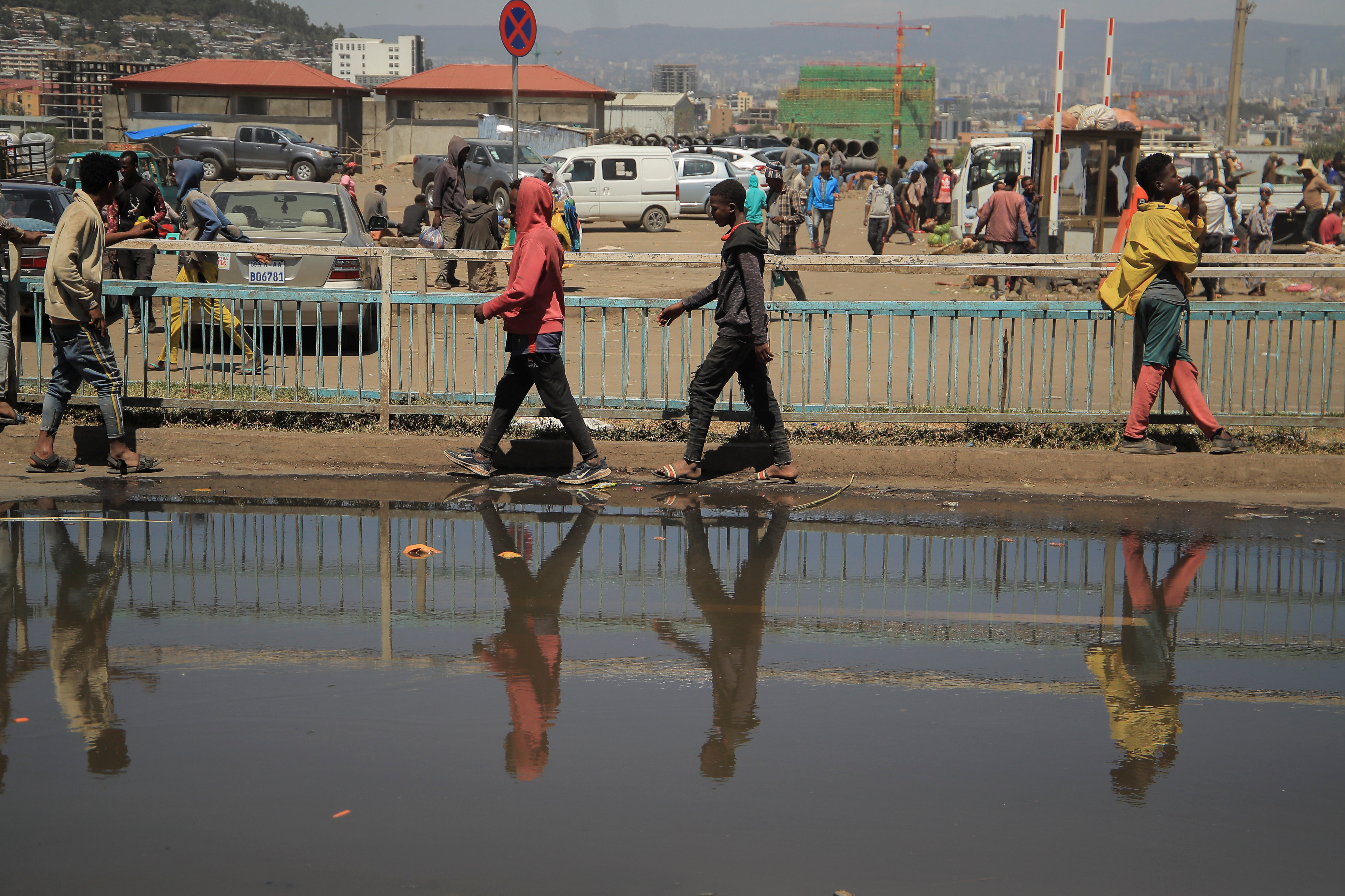 Pedestrians walk along a street in Lafto neighbourhood of Addis Ababa