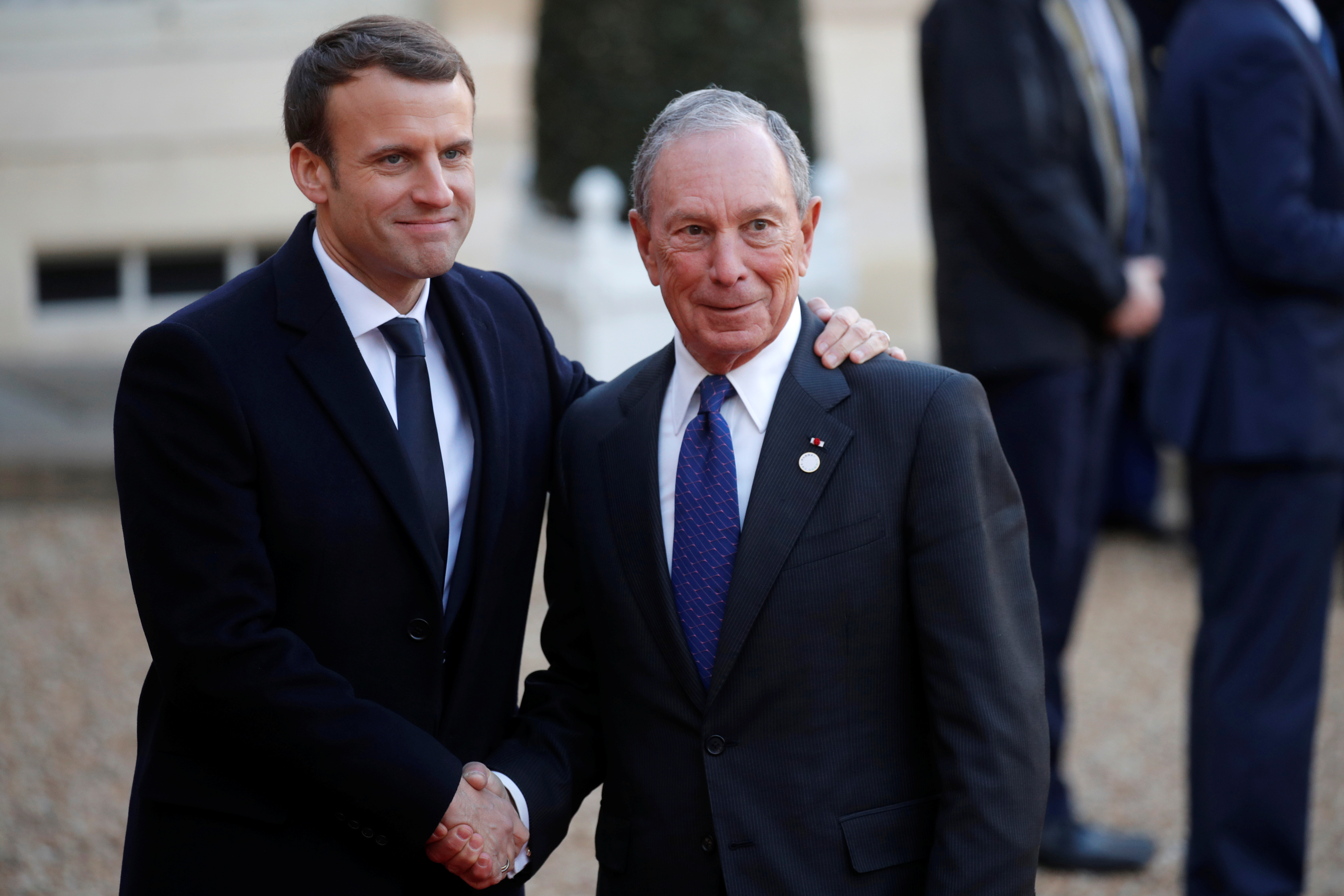 French President Emmanuel Macron welcomes Special envoy to the United Nations for climate change Michael Bloomberg as he arrives for a lunch at the Elysee Palace as part of the One Planet Summit in Paris