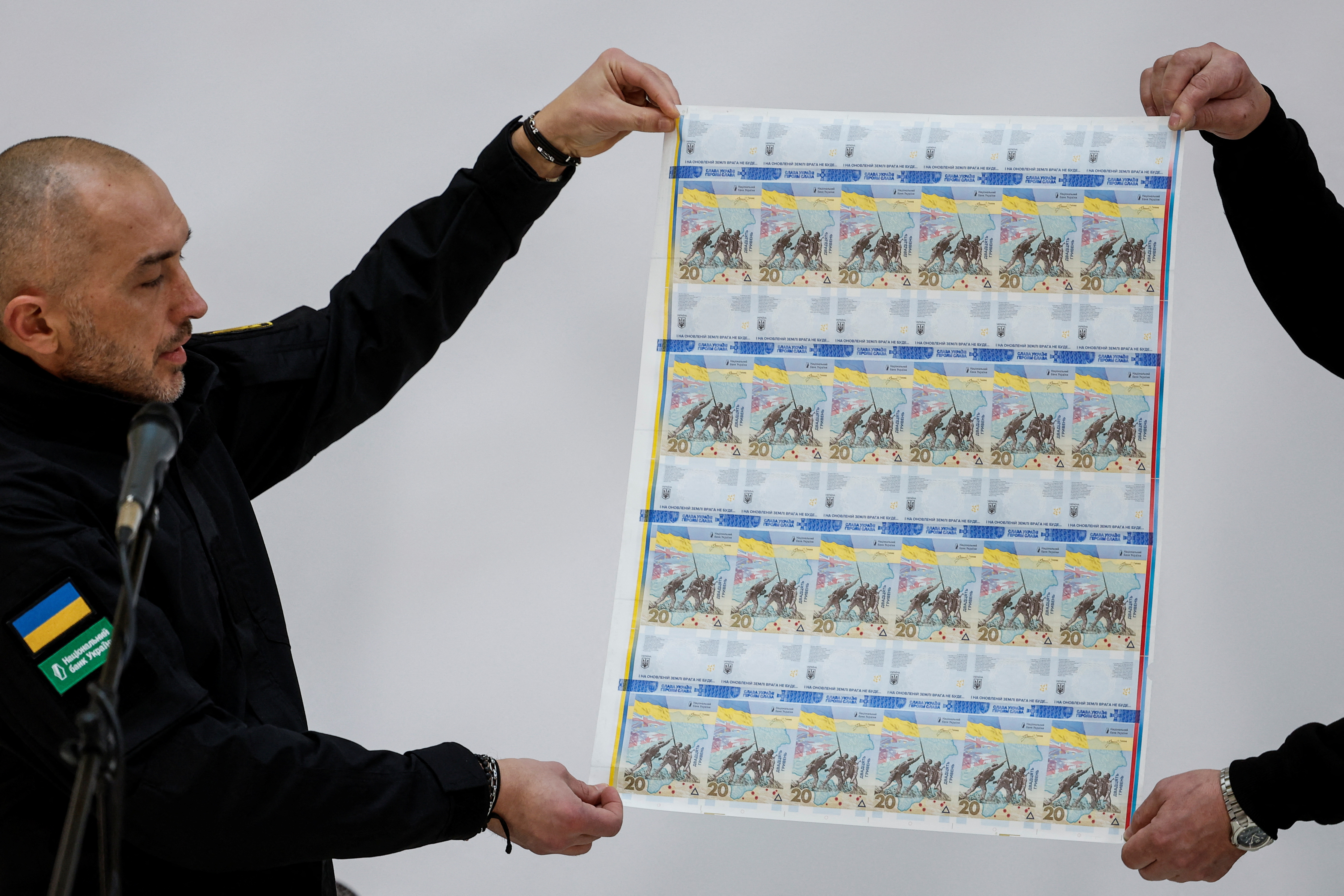 Banknotes dedicated the to first anniversary of Russia's invasion on Ukraine are presented in Kyiv