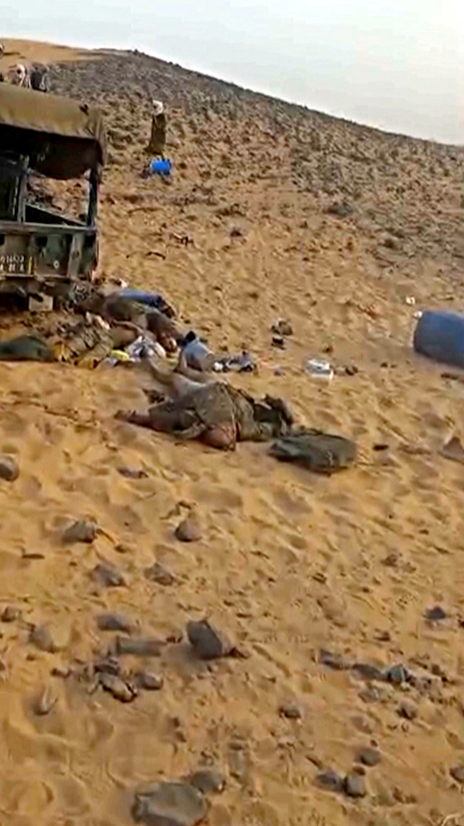 Casualties are seen among debris and damaged vehicles after clashes between Tuareg rebels and Russian Wagner mercenaries in northeastern Mali, near Tinzaouaten, Mali, July 2024.  via Coordination of Azawad Movements