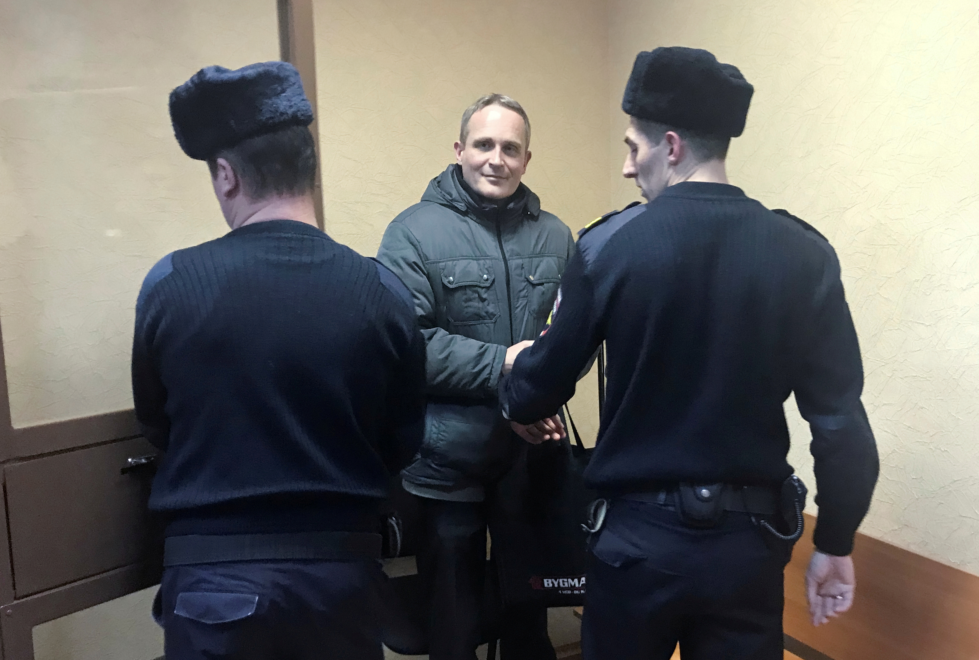 Dennis Christensen leaves after a court session in Oryol