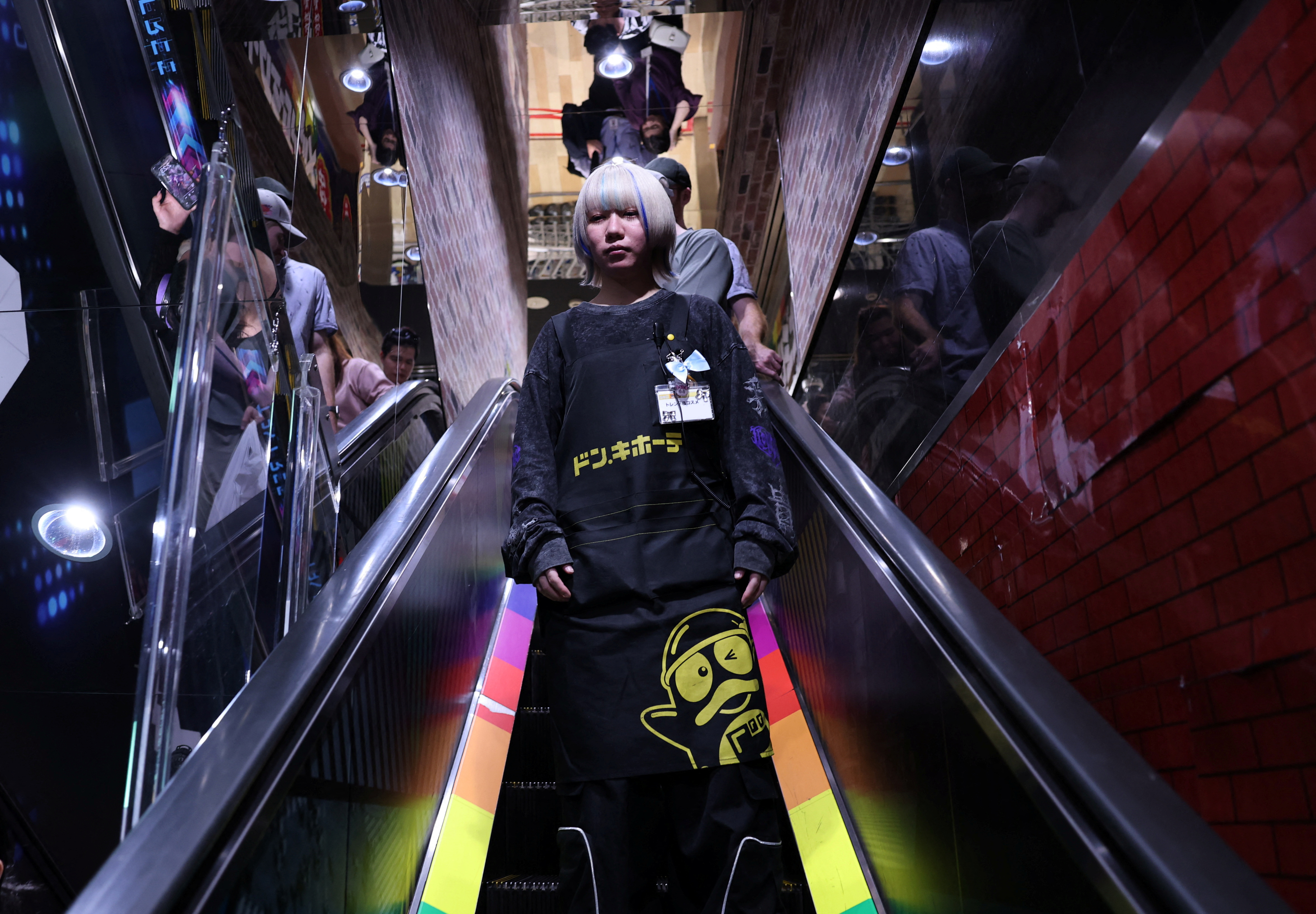 Dyed hair and nail art ok! More Japanese firms relax rules in tussle for workers | Reuters