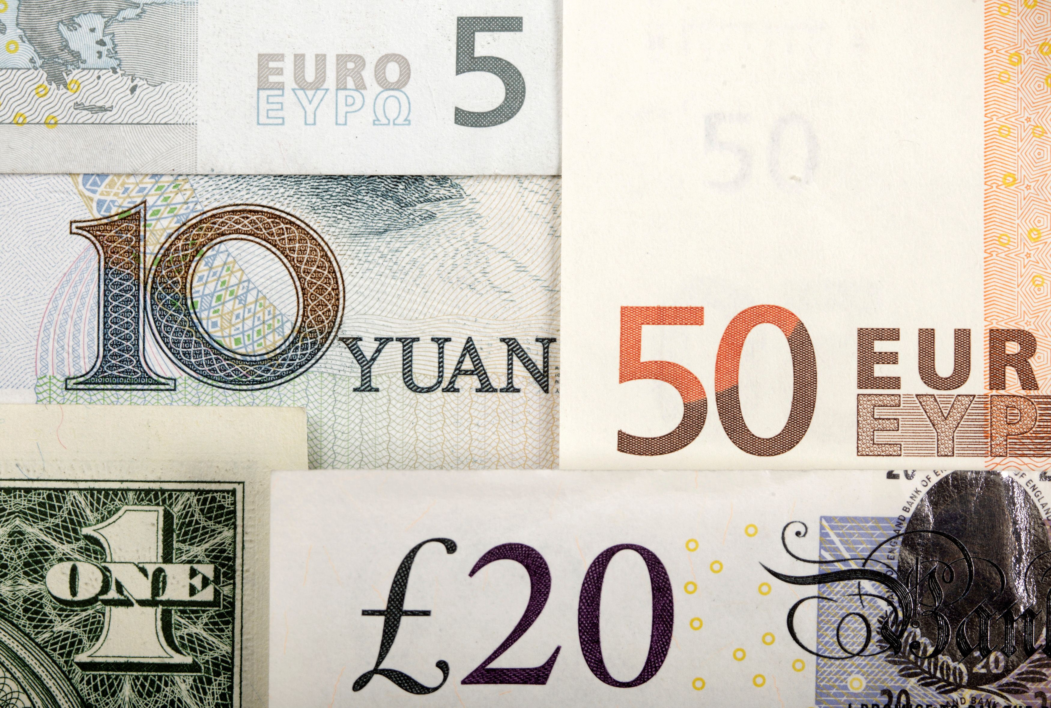 Arrangement of various world currencies including Chinese yuan, U.S. dollar, Euro, British pound