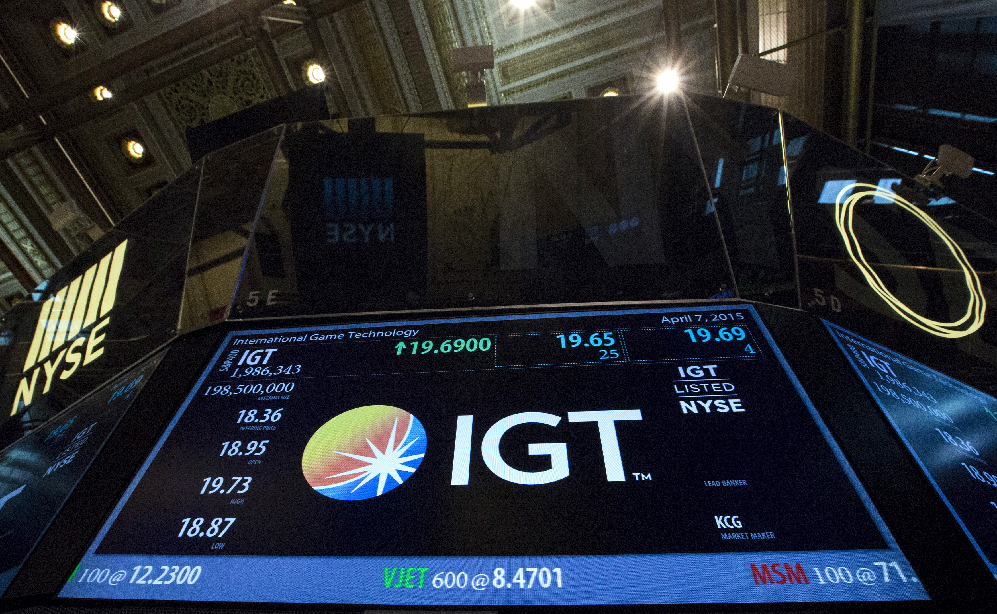 A screen displays the ticker symbol for International Game Technology PLC, at the post where it is traded following it's launch on the floor of the New York Stock Exchange
