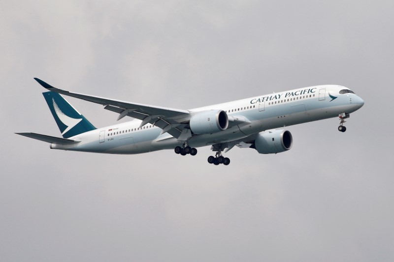 A Cathay Pacific Airways Airbus A350 airplane approaches to land at Changi International Airport in Singapore