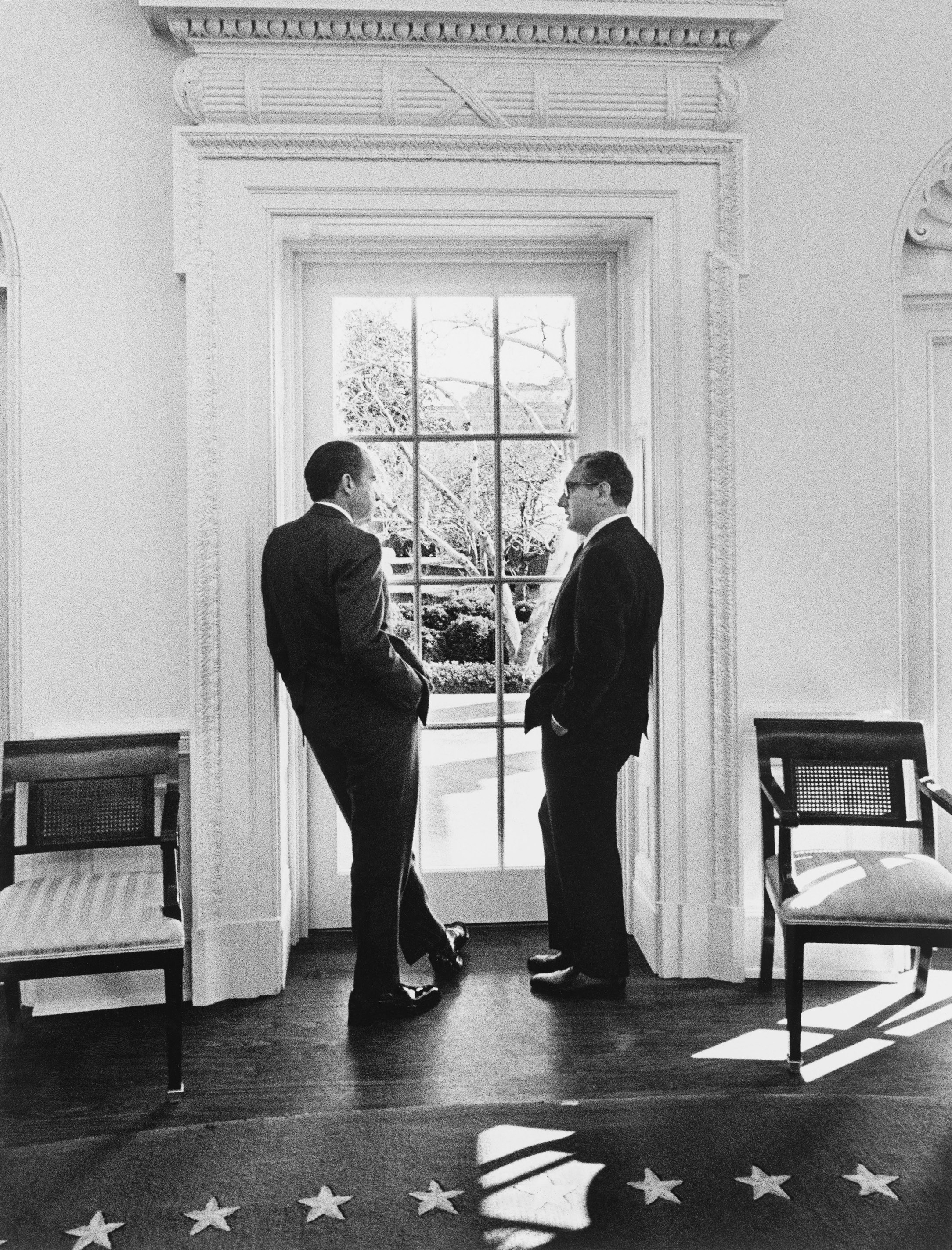 U.S. President Richard Nixon and Henry Kissinger stand by a window in the Oval Office, at the White House in Washington DC, U.S., February 10, 1971.  via Richard Nixon Museum and Library 