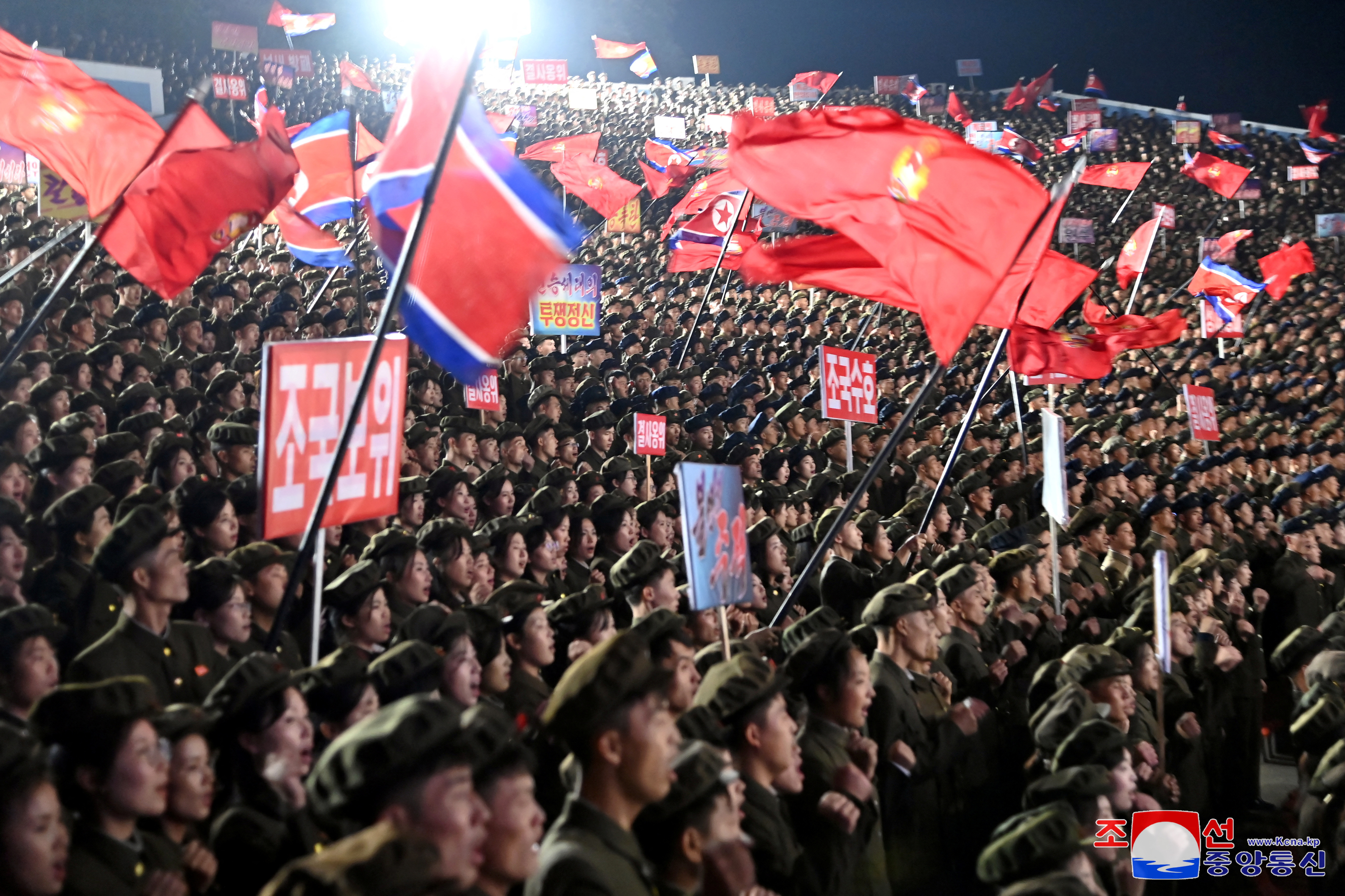 Young people, including students and youth league officials, participate in an army enlistment event at an undisclosed location in North Korea