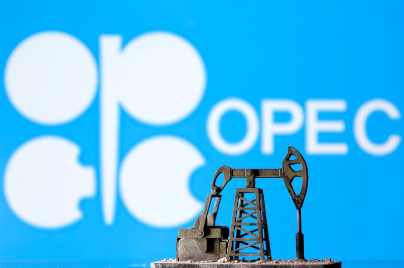 A 3D printed oil pump jack is seen in front of displayed Opec logo in this illustration picture, April 14, 2020. REUTERS/Dado Ruvic/Illustration 