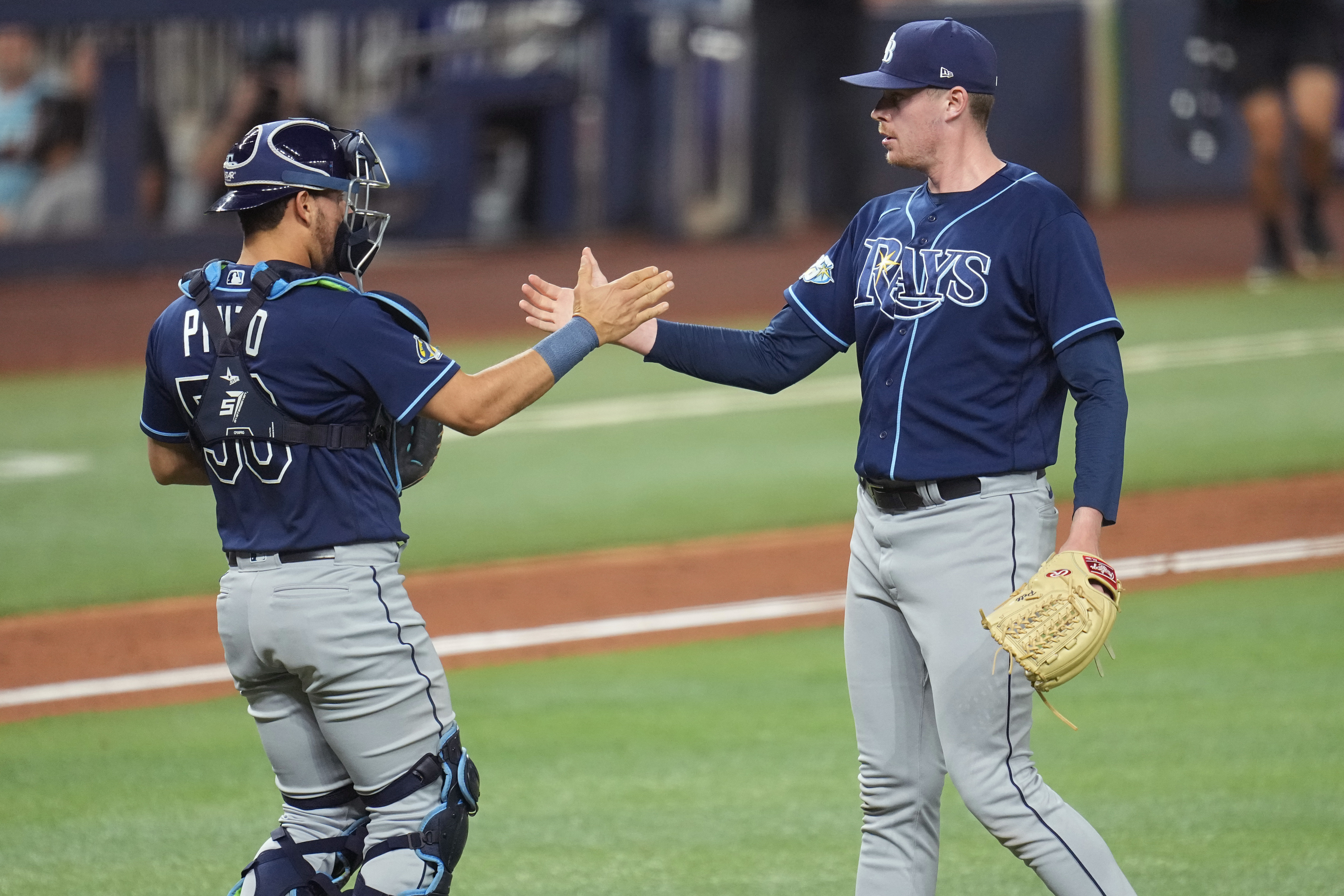 Tampa Bay Rays pitchers Shawn Armstrong, left, weaing a t-shirt to