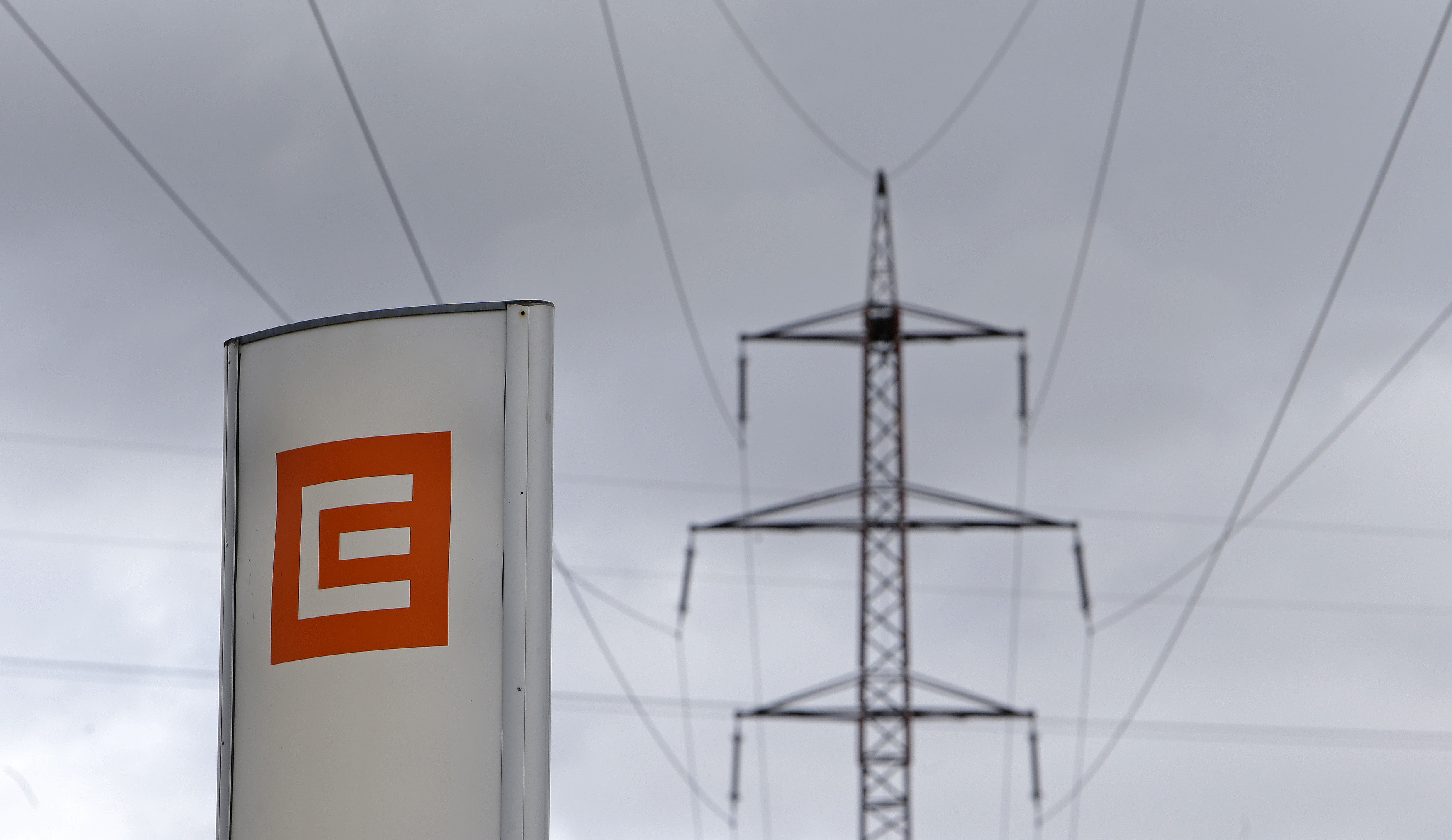 Czech electricity producer CEZ's logo is seen next to an electricity pylon in front of the Ledvice coal-fired power plant near the village of Ledvice