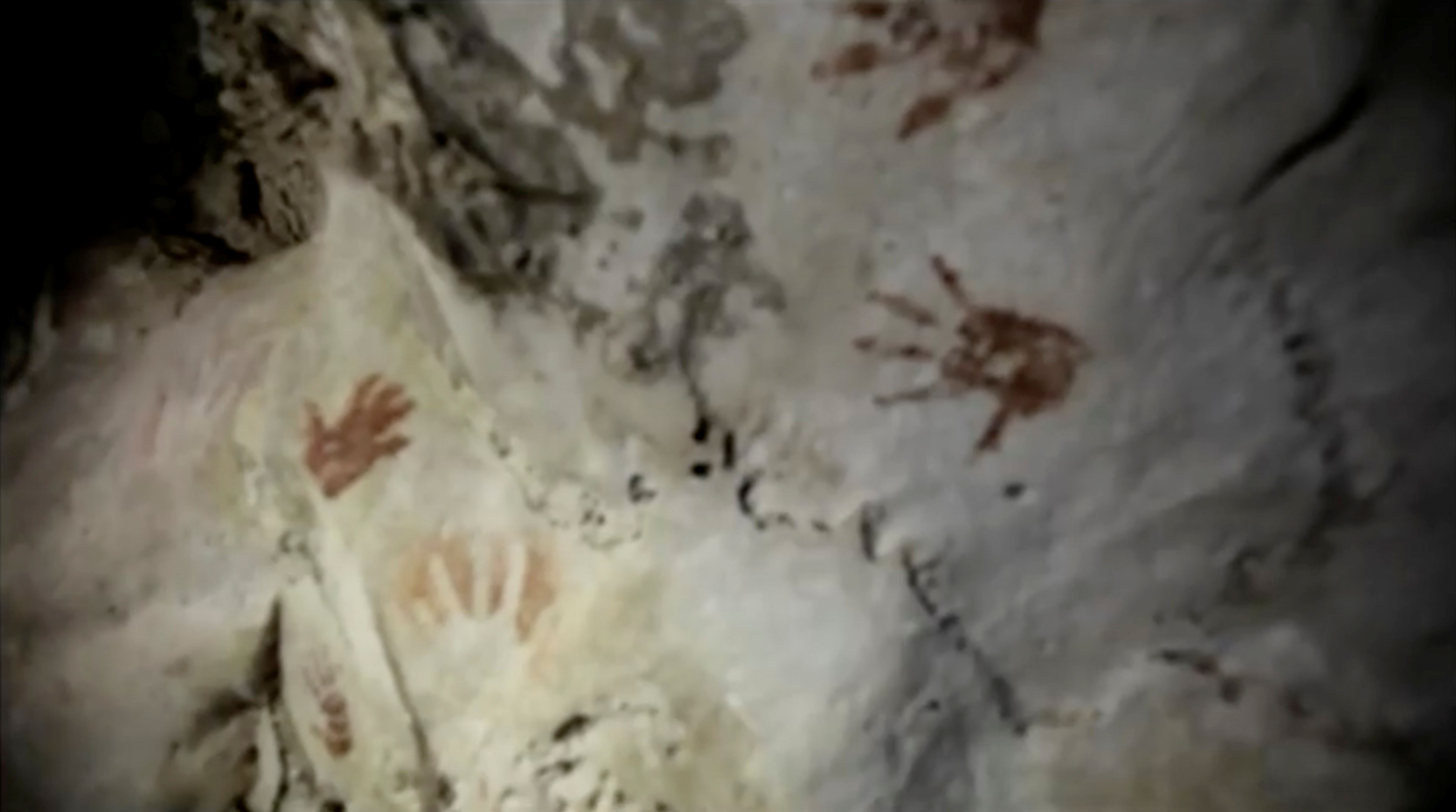 Hand prints, reportedly 1,200 years old, are seen on the cave walls, in Merida