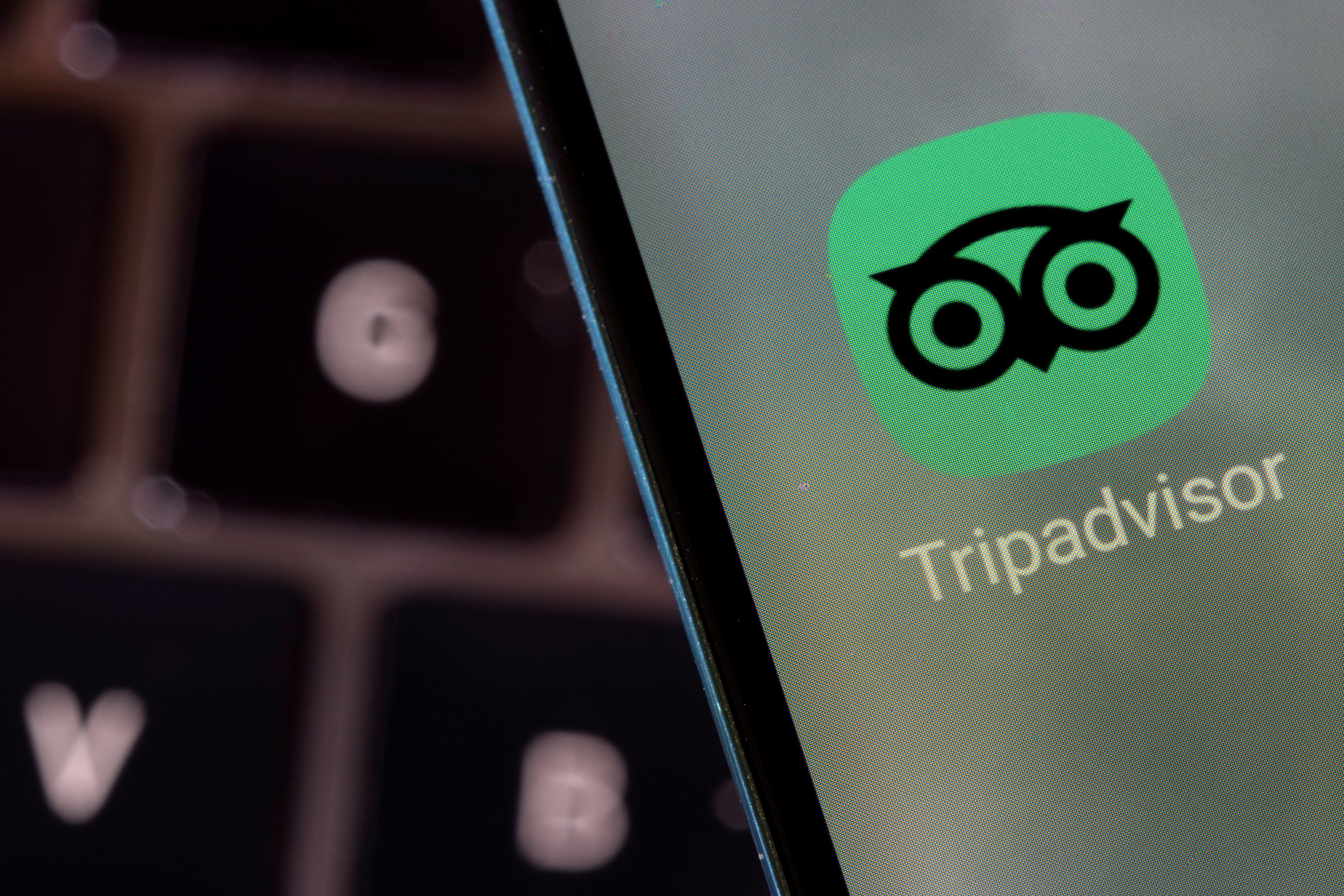 Illustration shows Tripadvisor app