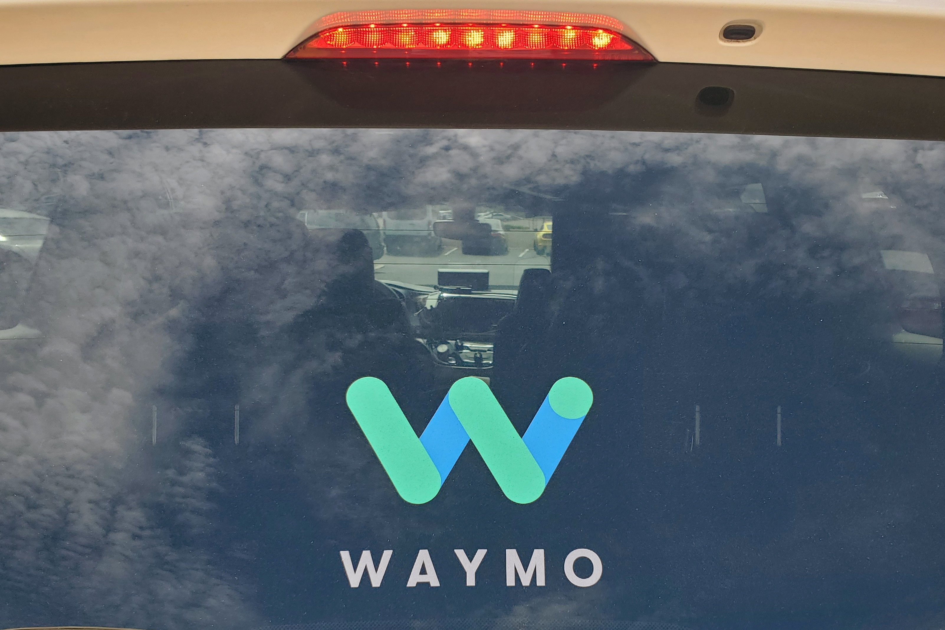 Rear window of a Waymo Chrysler Pacifica robotaxi is seen while parked in Tempe