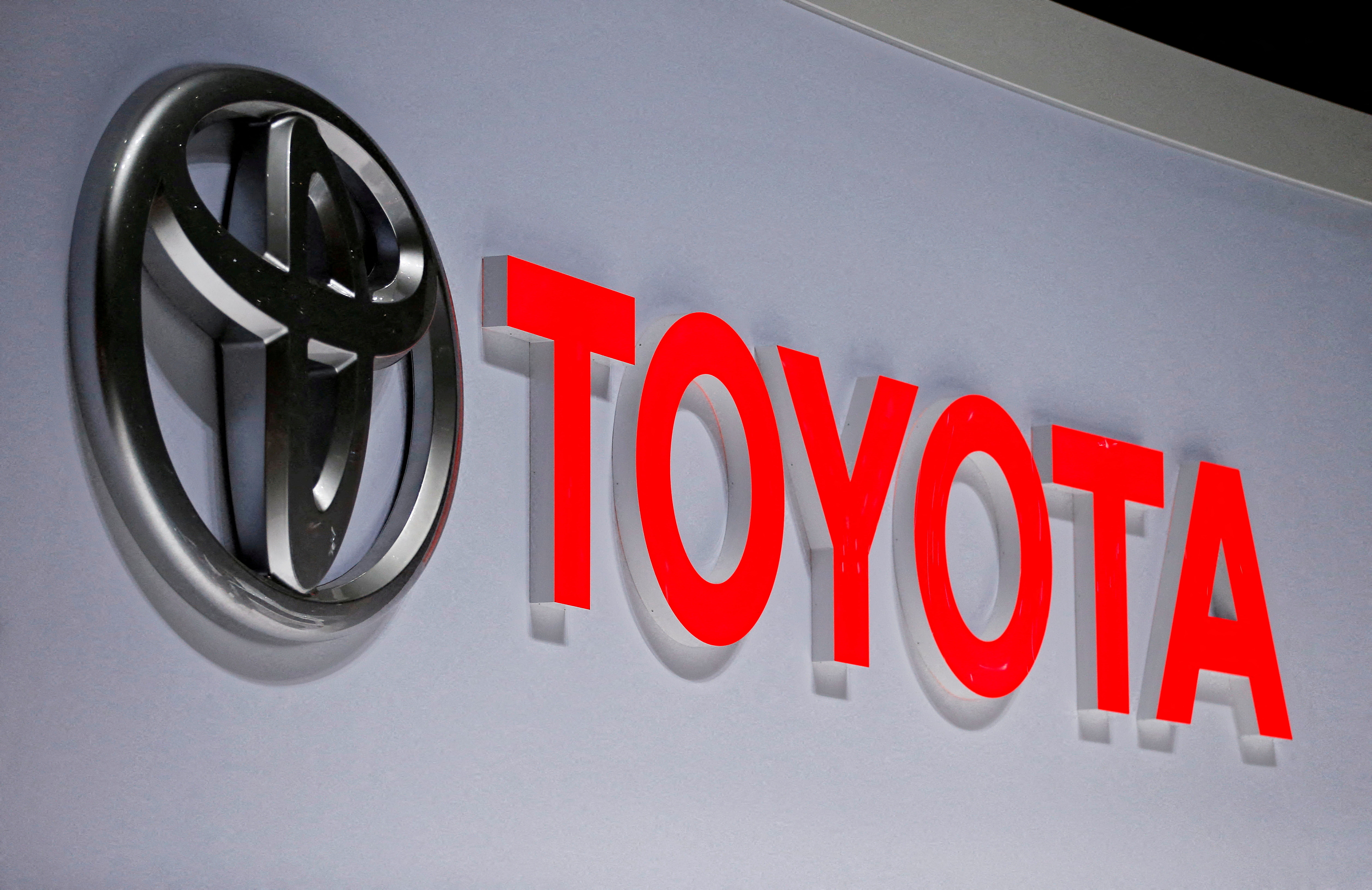 The Toyota logo is on display at the 89th Geneva International Motor Show