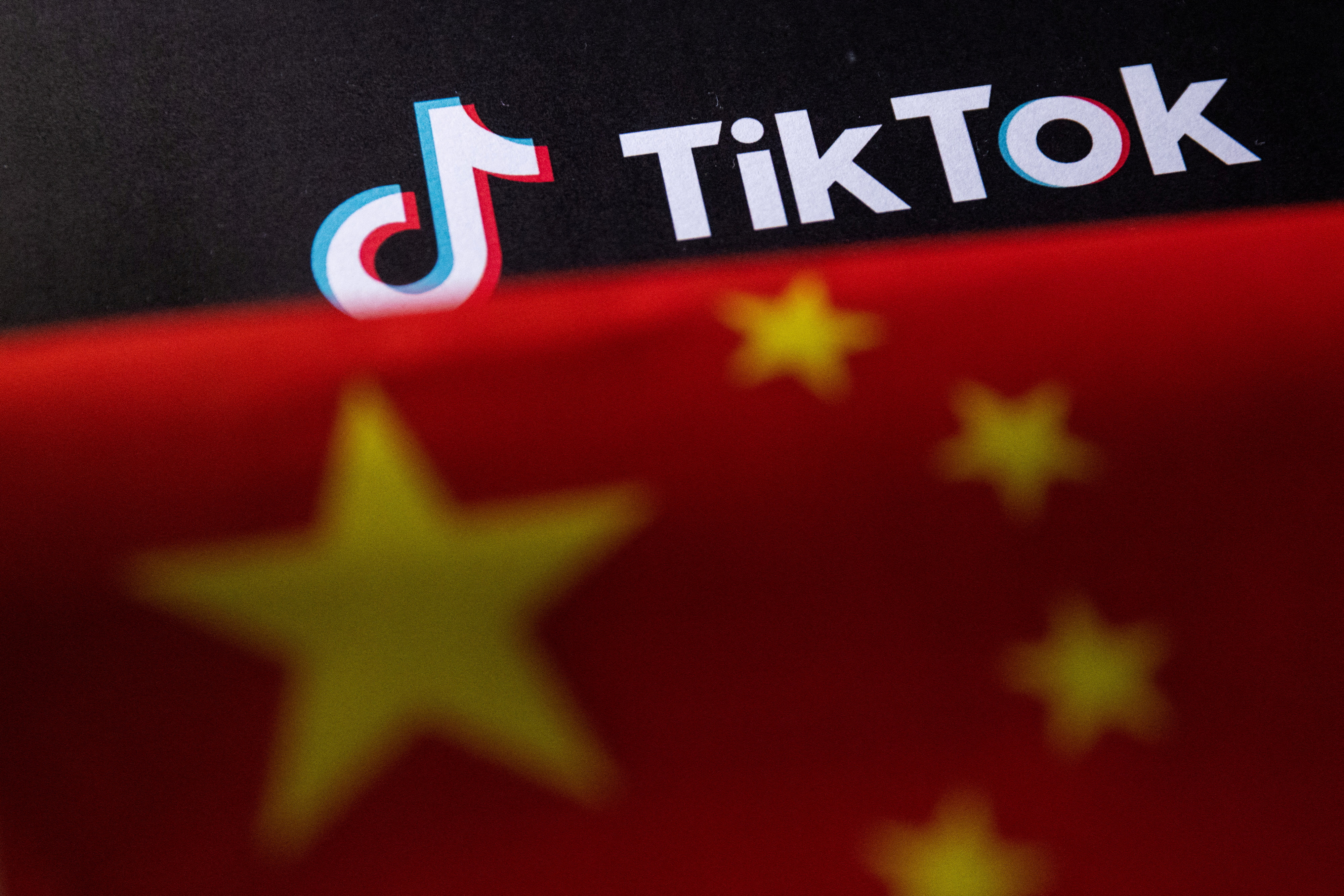 Illustration shows Chinese flag and TikTok logo