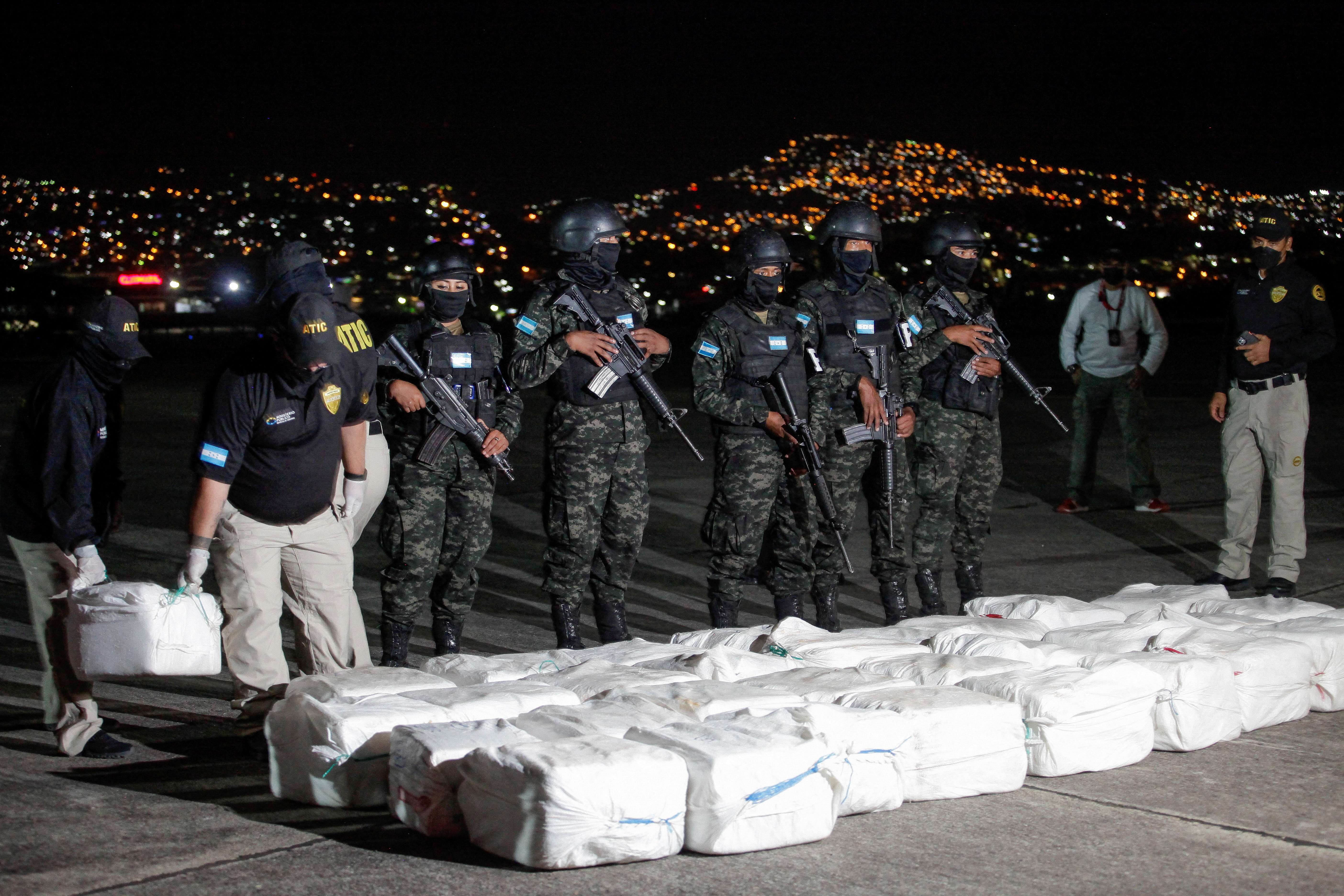 U.N. Report: Cocaine market is booming as meth trafficking spreads 3 Officers of Honduras' Technical Agency for Criminal Investigation carry a package containing cocaine seized during a police operation, at a presentation to the media, in Tegucigalpa