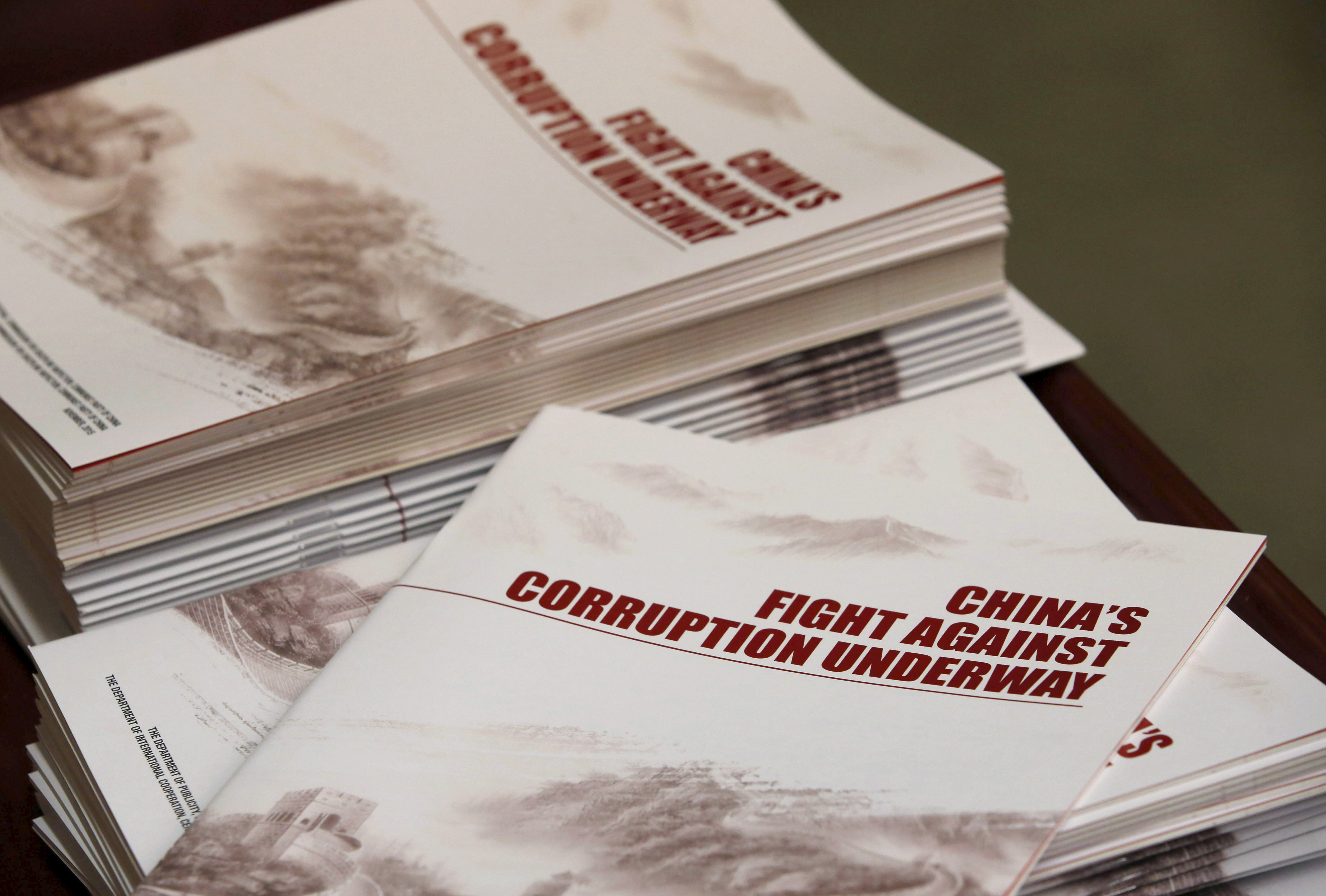 Copies of a booklet from the Central Commission for Discipline Inspection, the ruling Communist Party's anti-graft watchdog, is seen on a table during their news conference in Beijing
