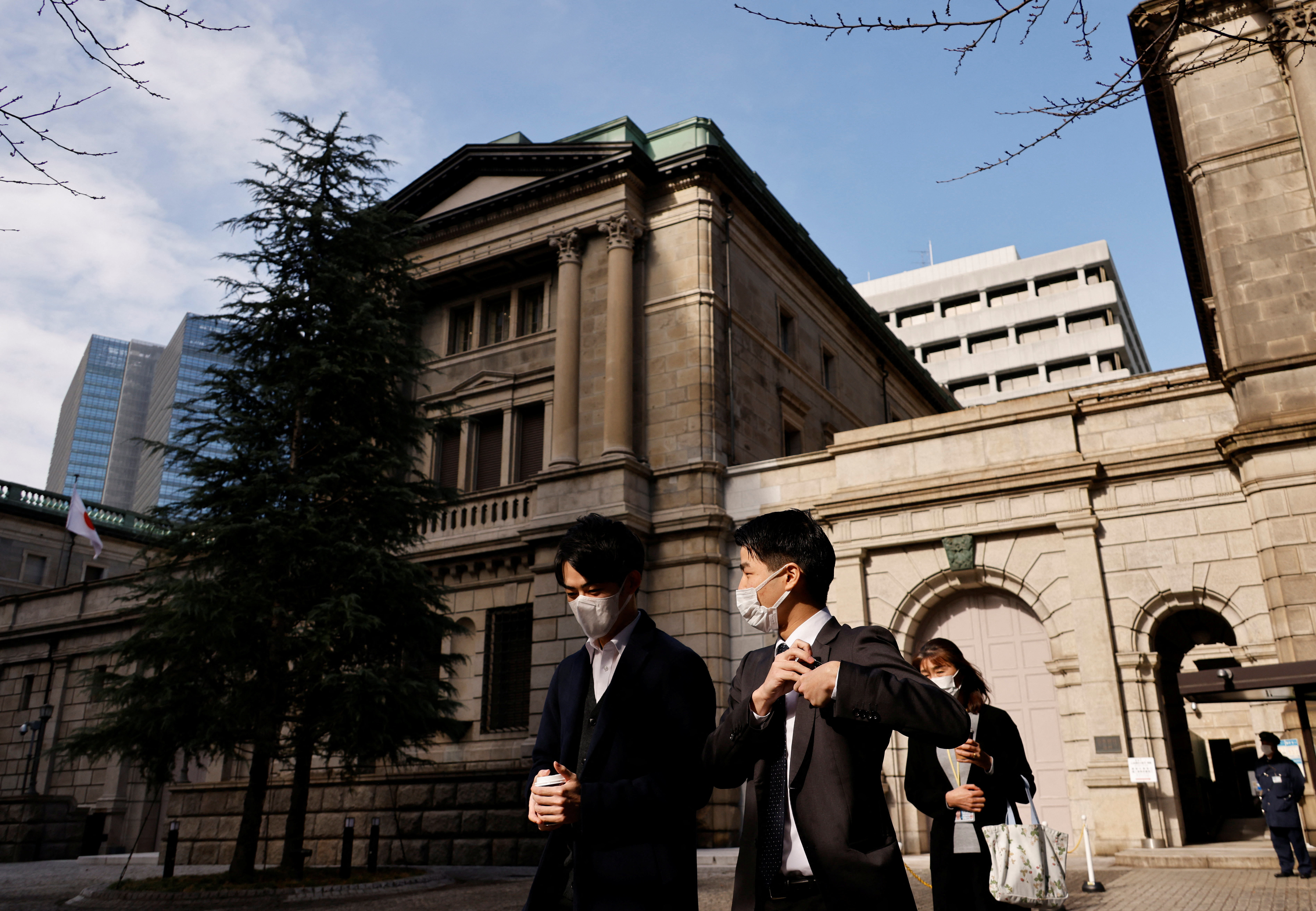 People walk at the headquarters of Bank of Japan in Tokyo