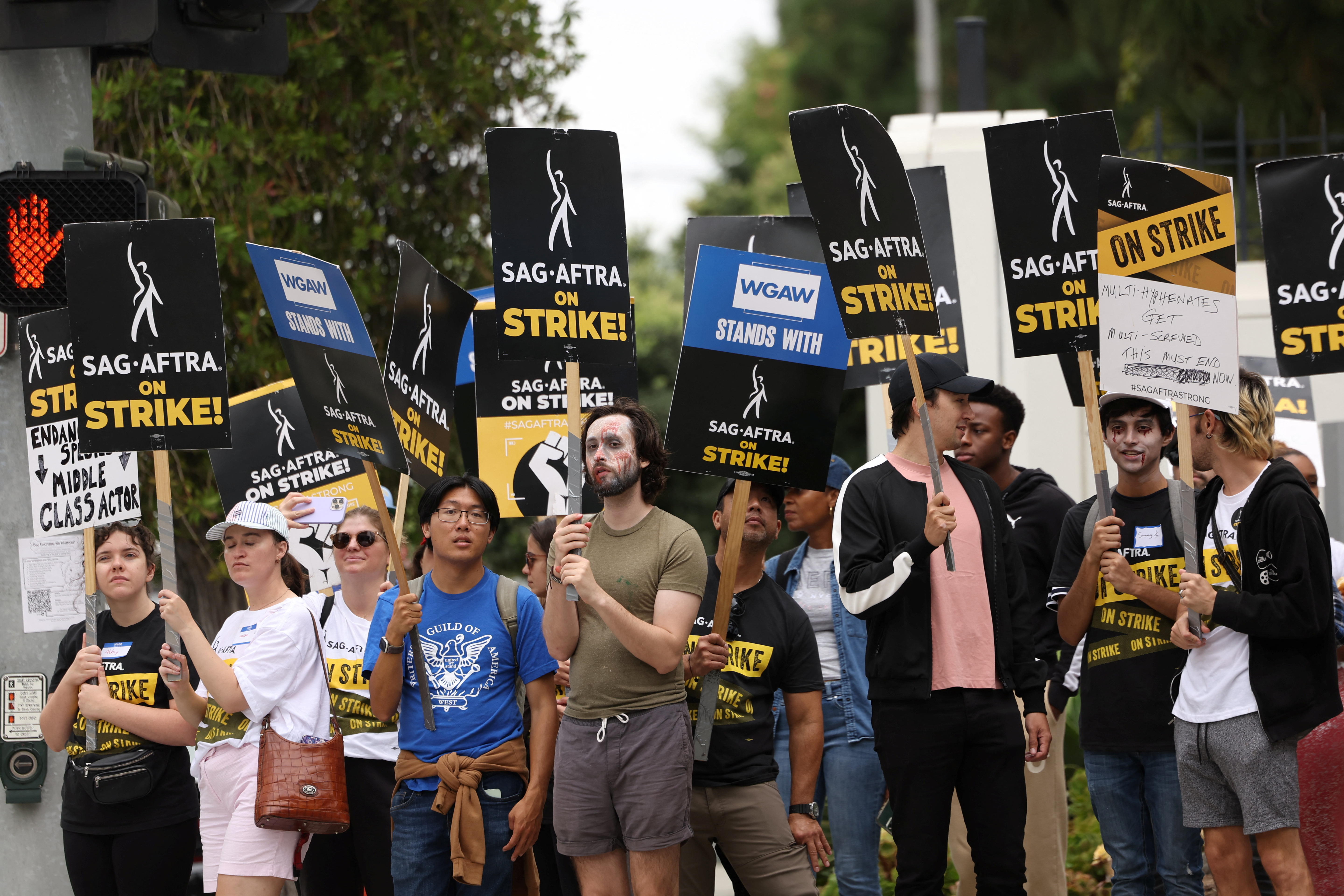 SAG-AFTRA members walk the picket line during their ongoing strike outside Sony Studios in Culver City