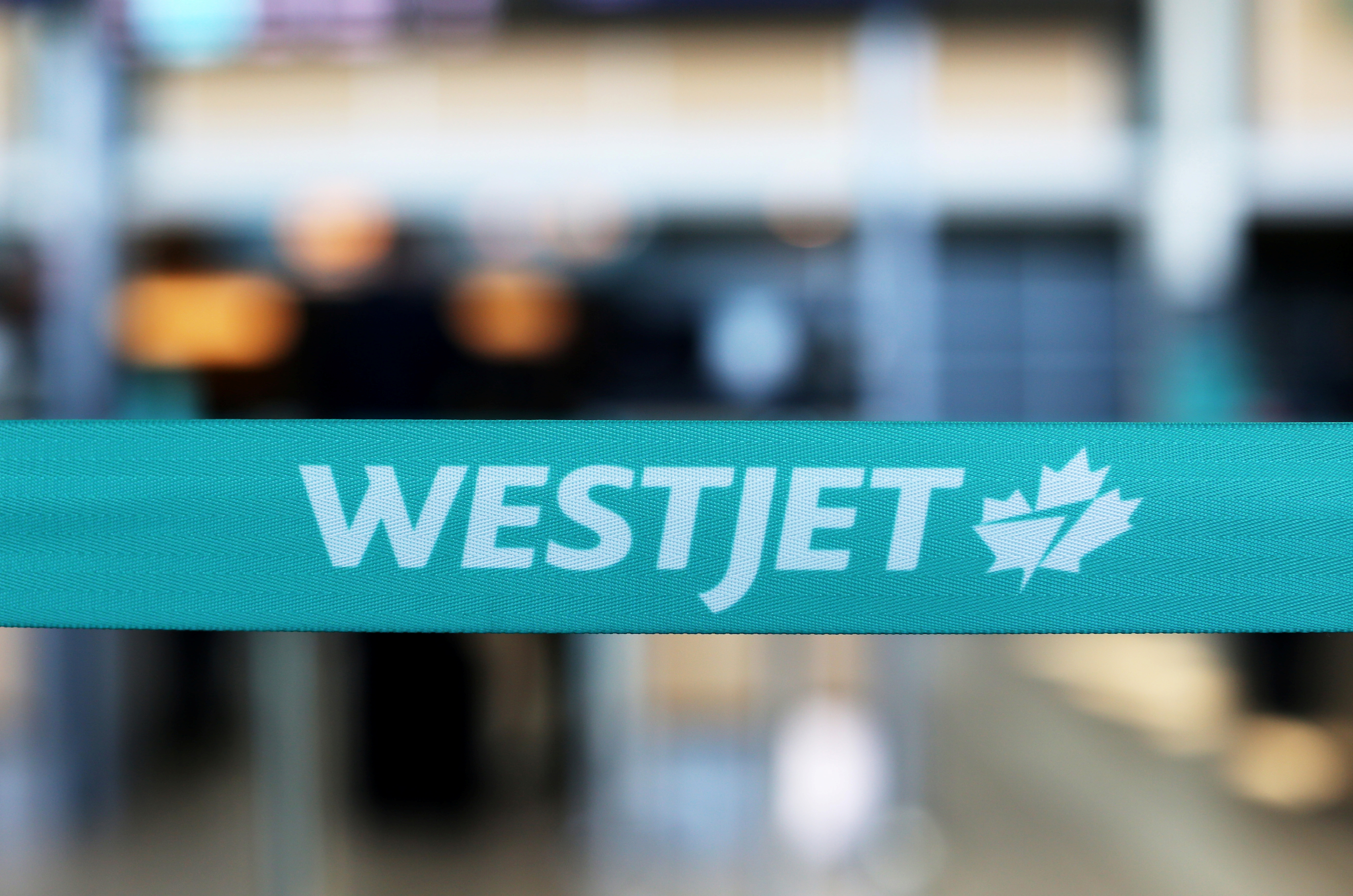 WestJet airline signage is pictured at Vancouver's international airport in Richmond,