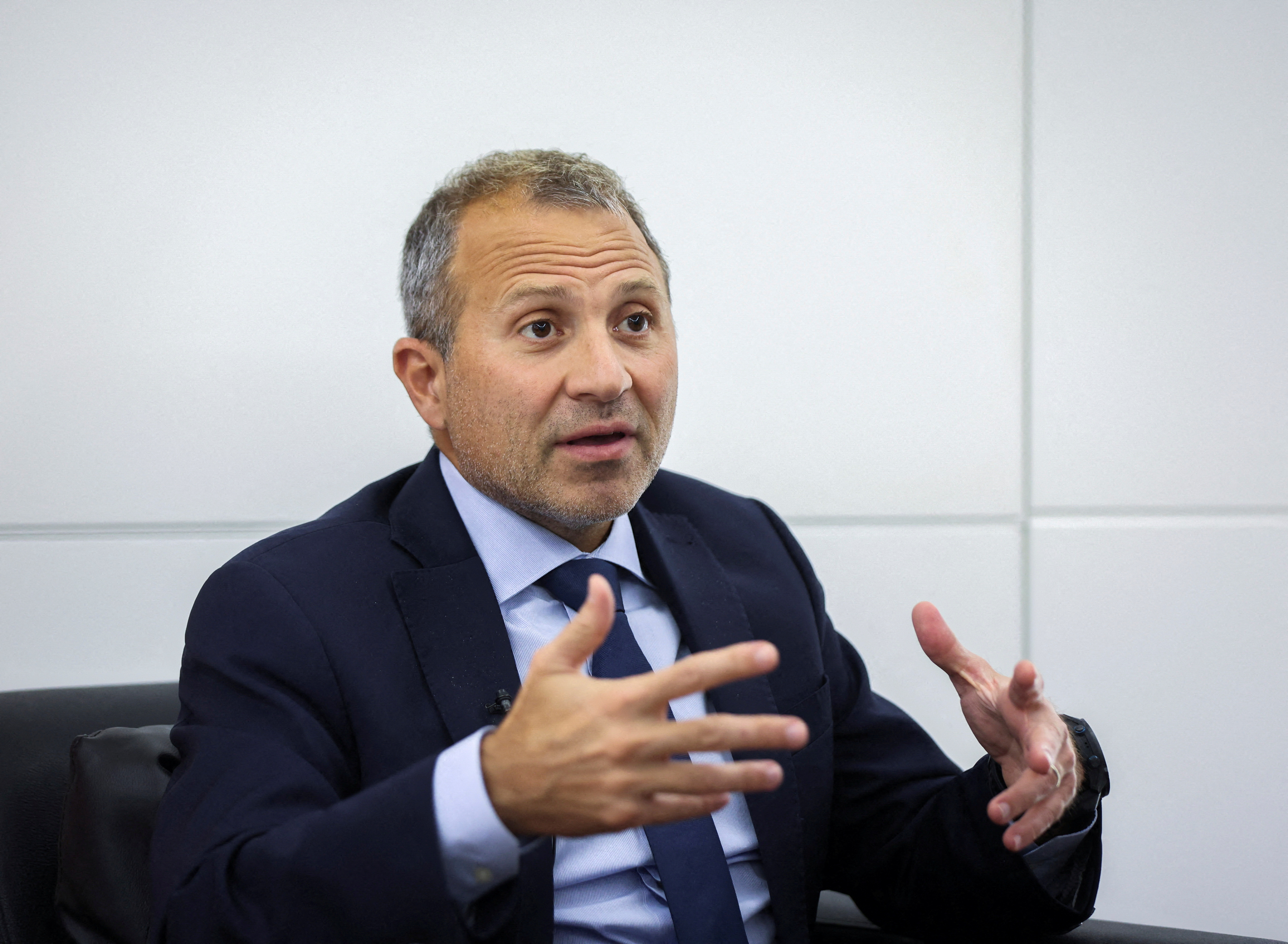 Gebran Bassil, a Christian member of parliament and former minister gestures as he speaks during an interview with Reuters in Sin-el-fil