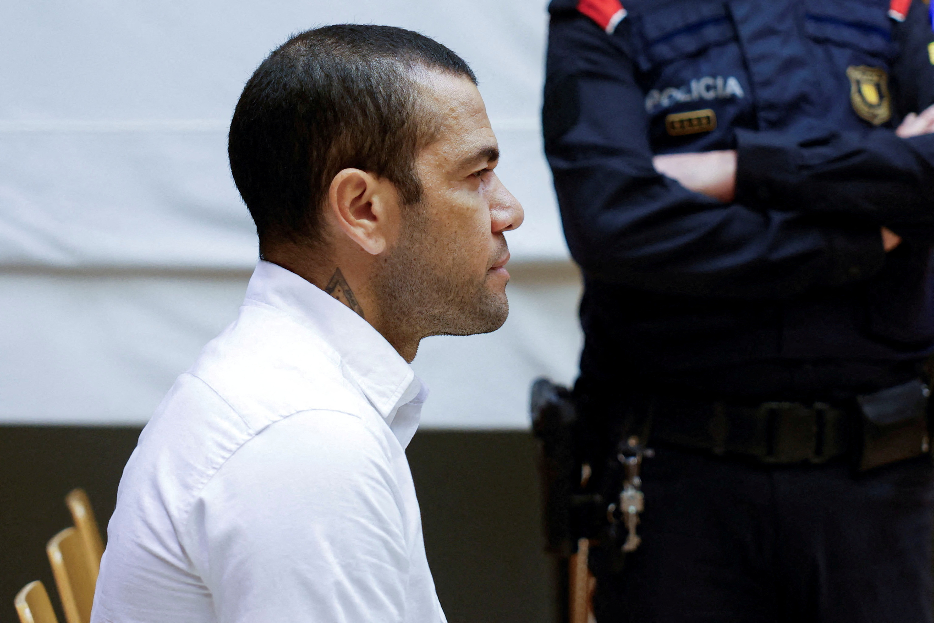 Brazil soccer player Dani Alves sits in court during the first day of his trial in Barcelona