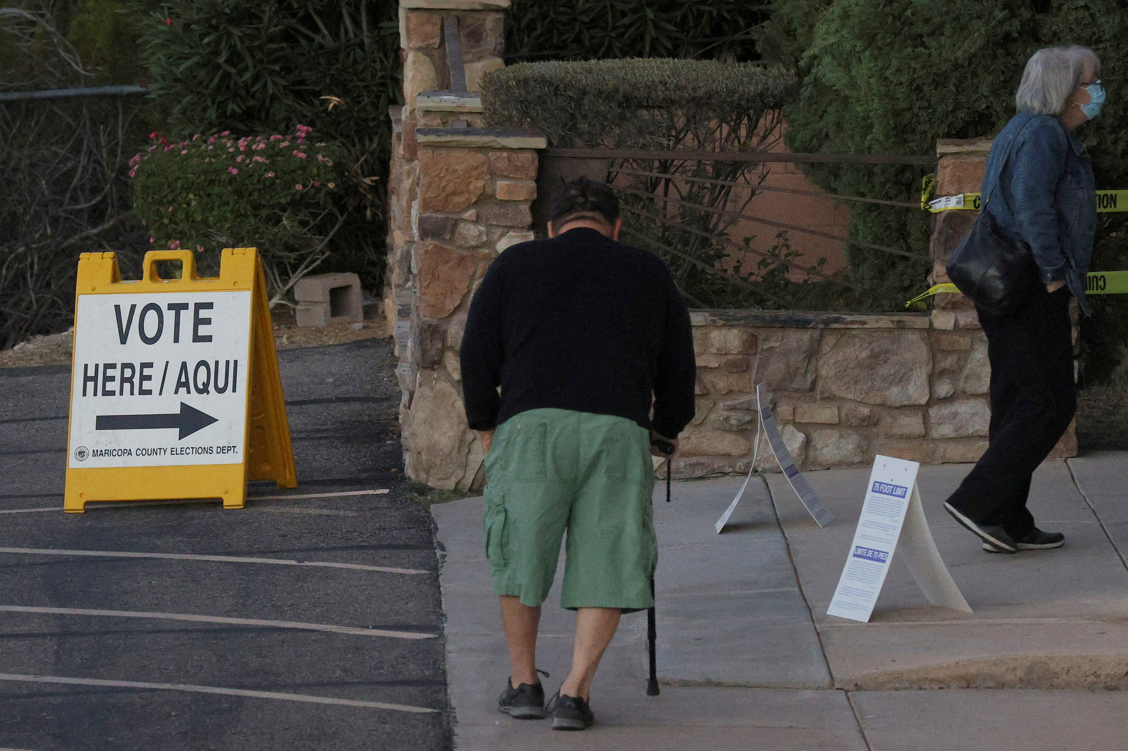 Voters arrive to cast their ballots in the midterm elections in Phoenix