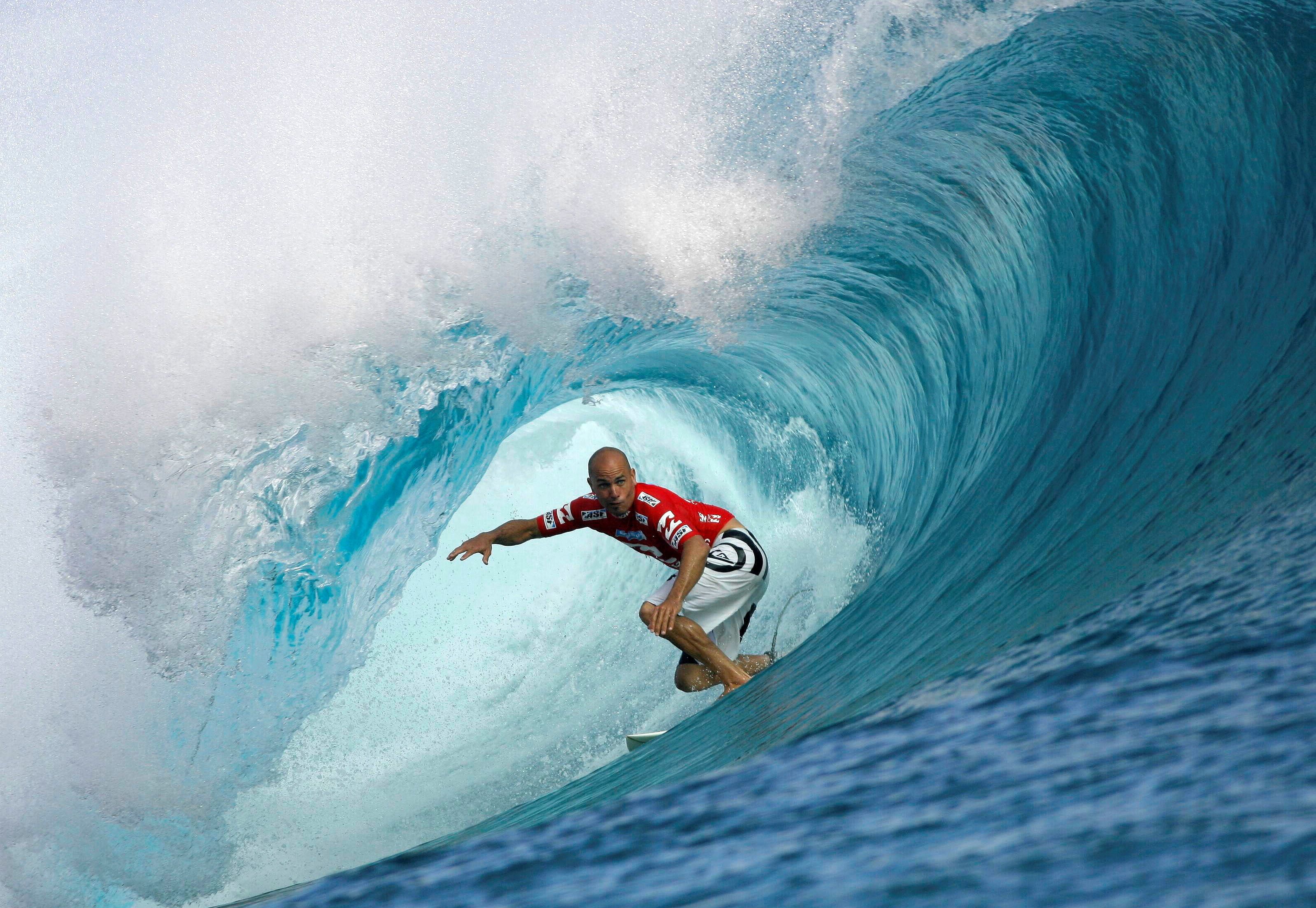 Surfer Slater of the U.S rides a wave during the third round of competition in the Billabong Pro surfing tournament on the legendary reef break in Teahupoo
