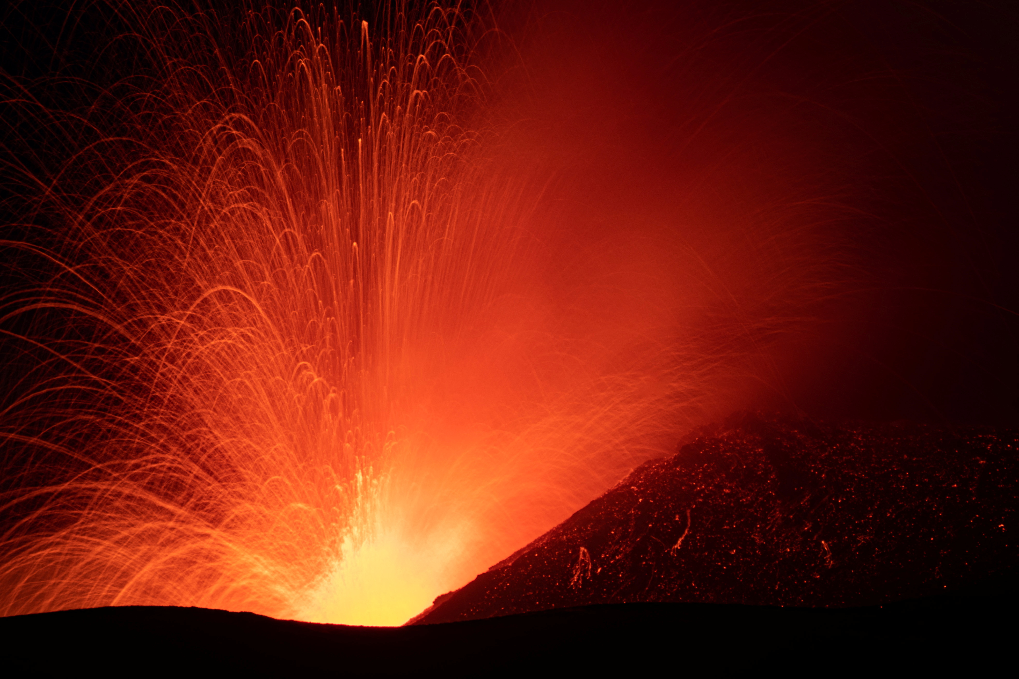 Lava and ash spew from Italy's Mount Etna volcano August 15, 2024