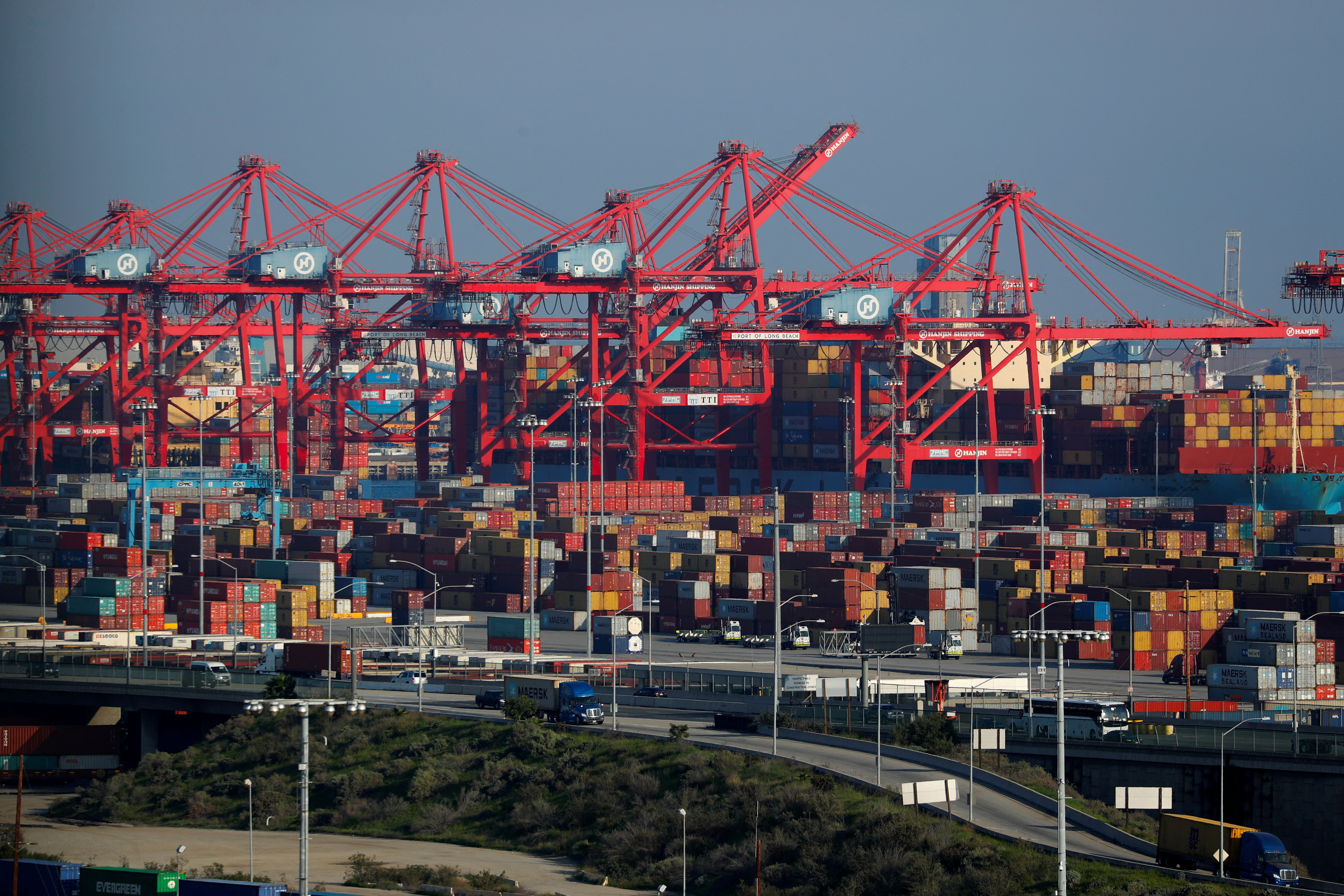 Ships and shipping containers are pictured at the port of Long Beach in Long Beach, California