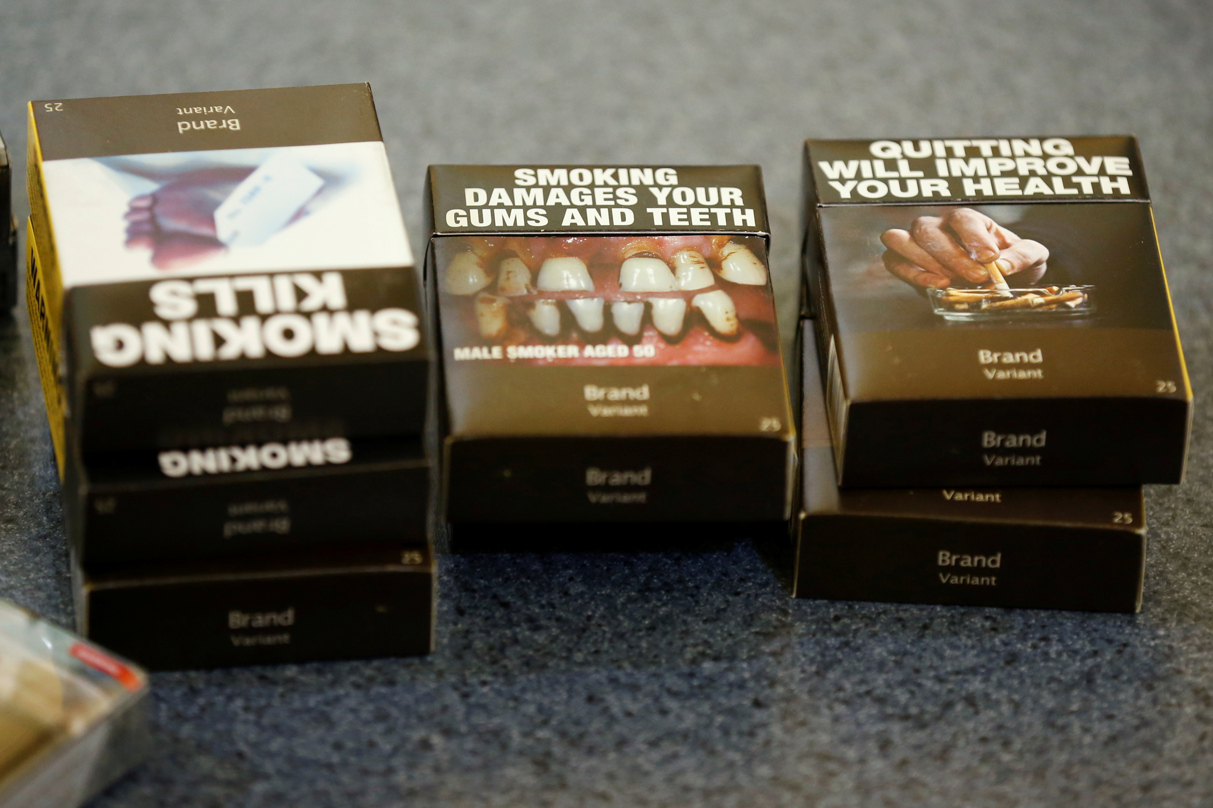 Mock-ups of plain cigarette packaging are seen before the start of a news conference in Ottawa