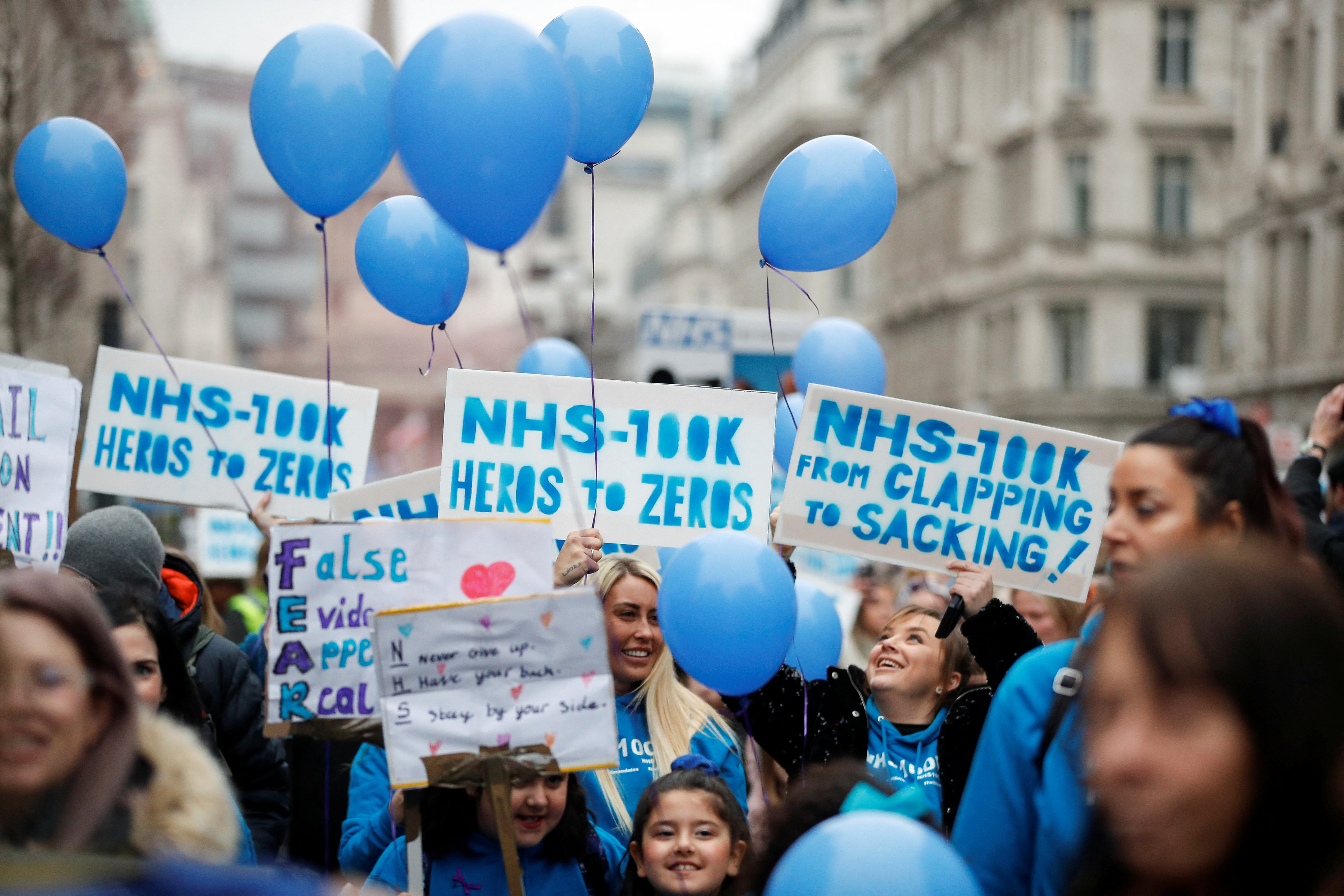 NHS staff march in a protest against vaccine mandates, in London