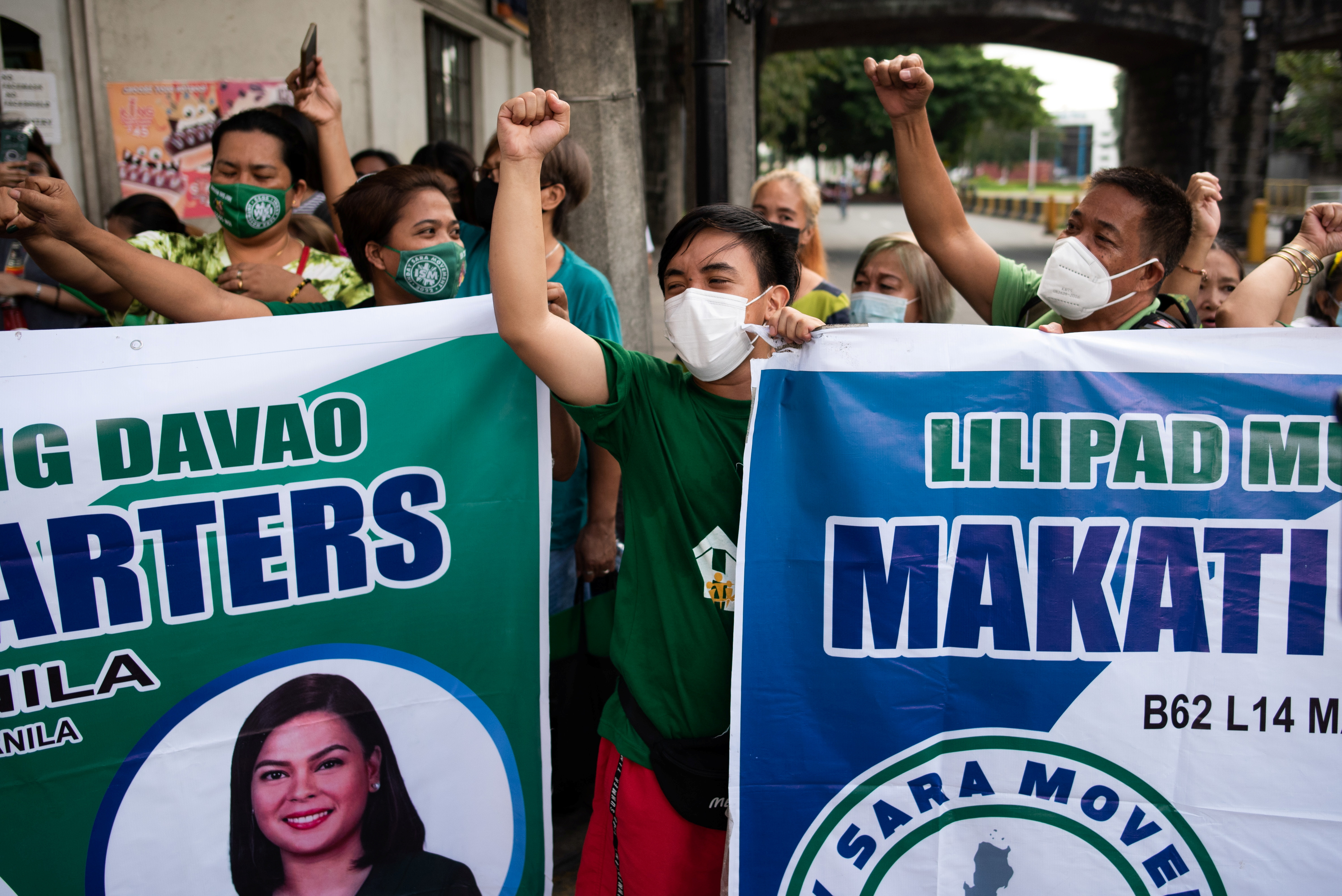 Supporters of Davao City Mayor Sara Duterte gather outside the Commission on Elections, after representatives filed her certificate of candidacy for vice president for the 2022 national election, in Manila, Philippines, November 13, 2021. REUTERS/Lisa Marie David
