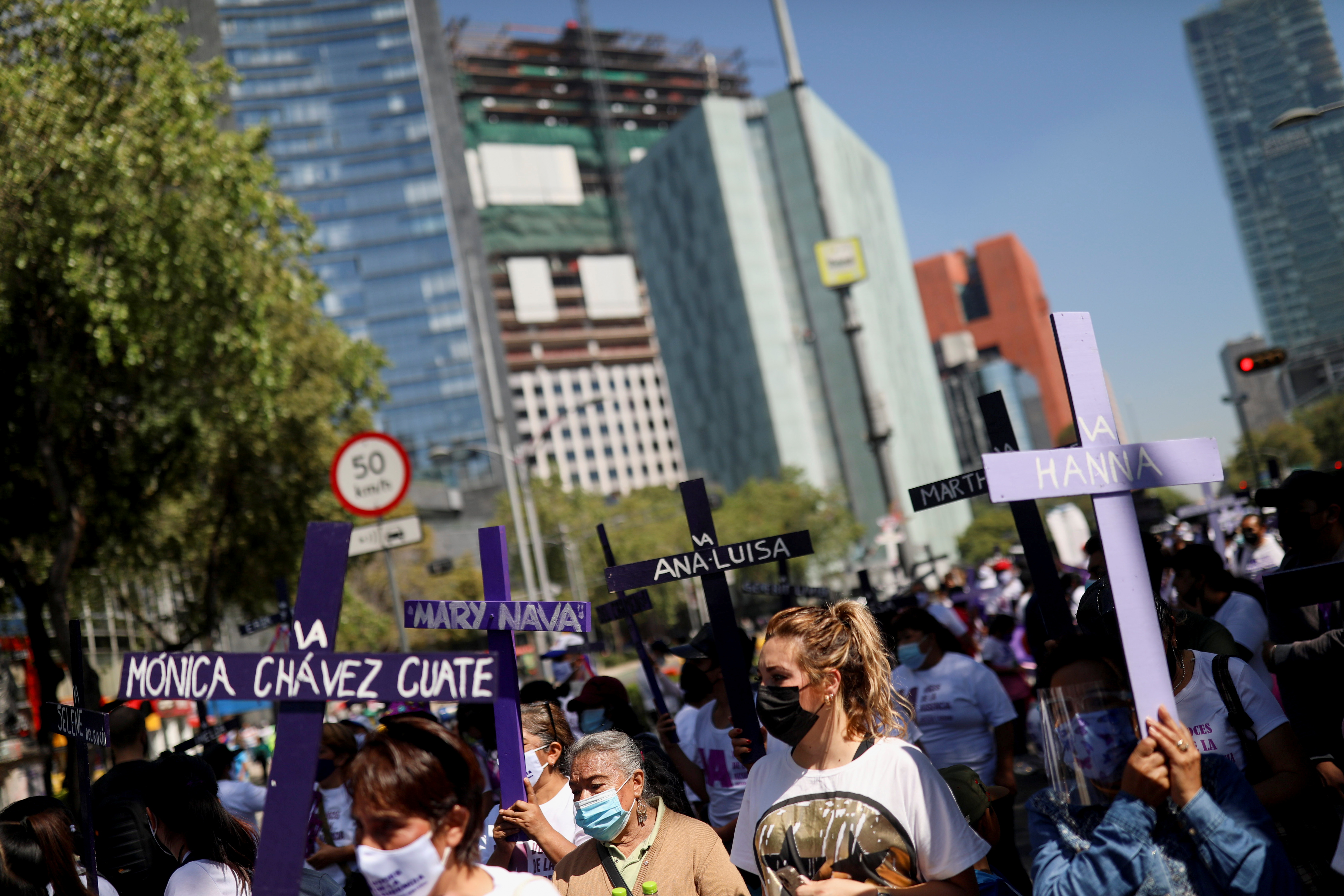 Relatives of victims of femicide hold a march in memory of their loved ones