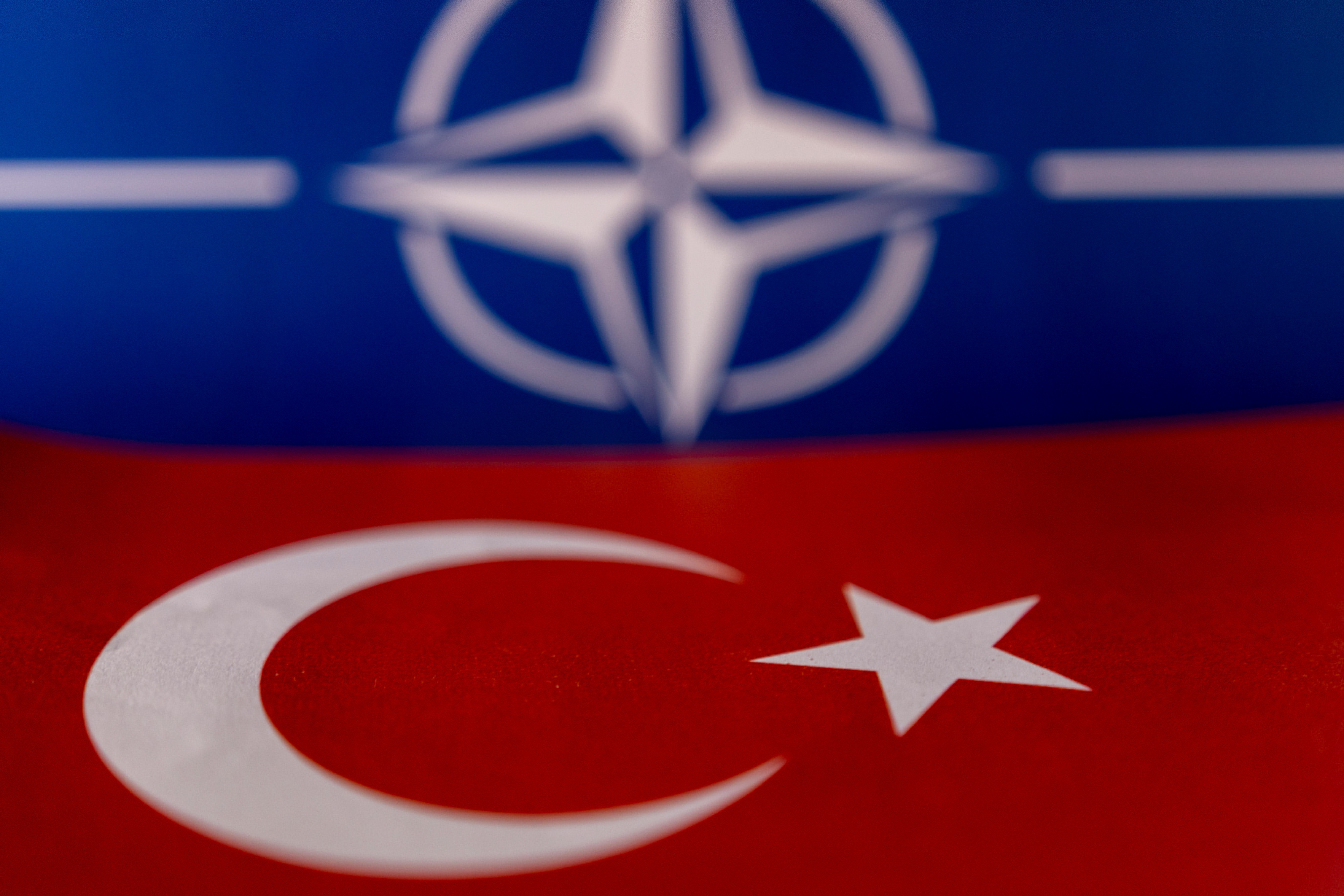 Illustration shows NATO and Turkish flags