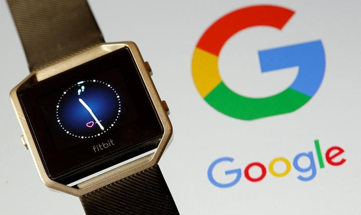 Fitbit Blaze watch is seen in front of a displayed Google logo in this illustration