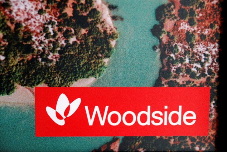 The logo for Woodside Petroleum, Australia's top independent oil and gas company, adorns a promotional poster on display at a briefing for investors in Sydney