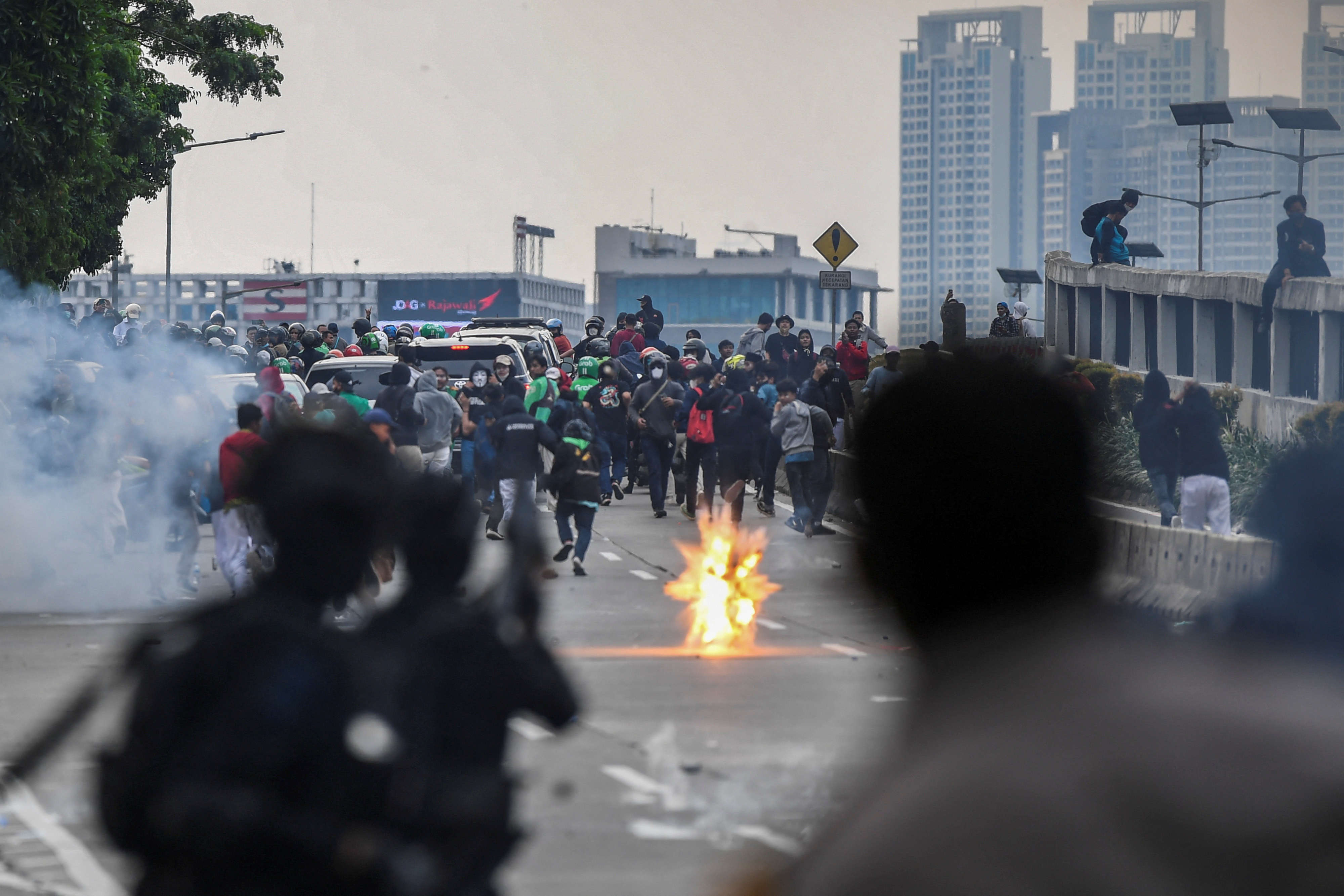 Indonesia police fire tear gas to disperse protest at parliament | Reuters