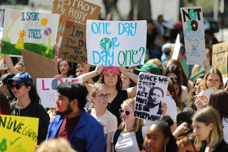 Students attend a protest rally to call for urgent action to slow the pace of climate change, in Los Angeles