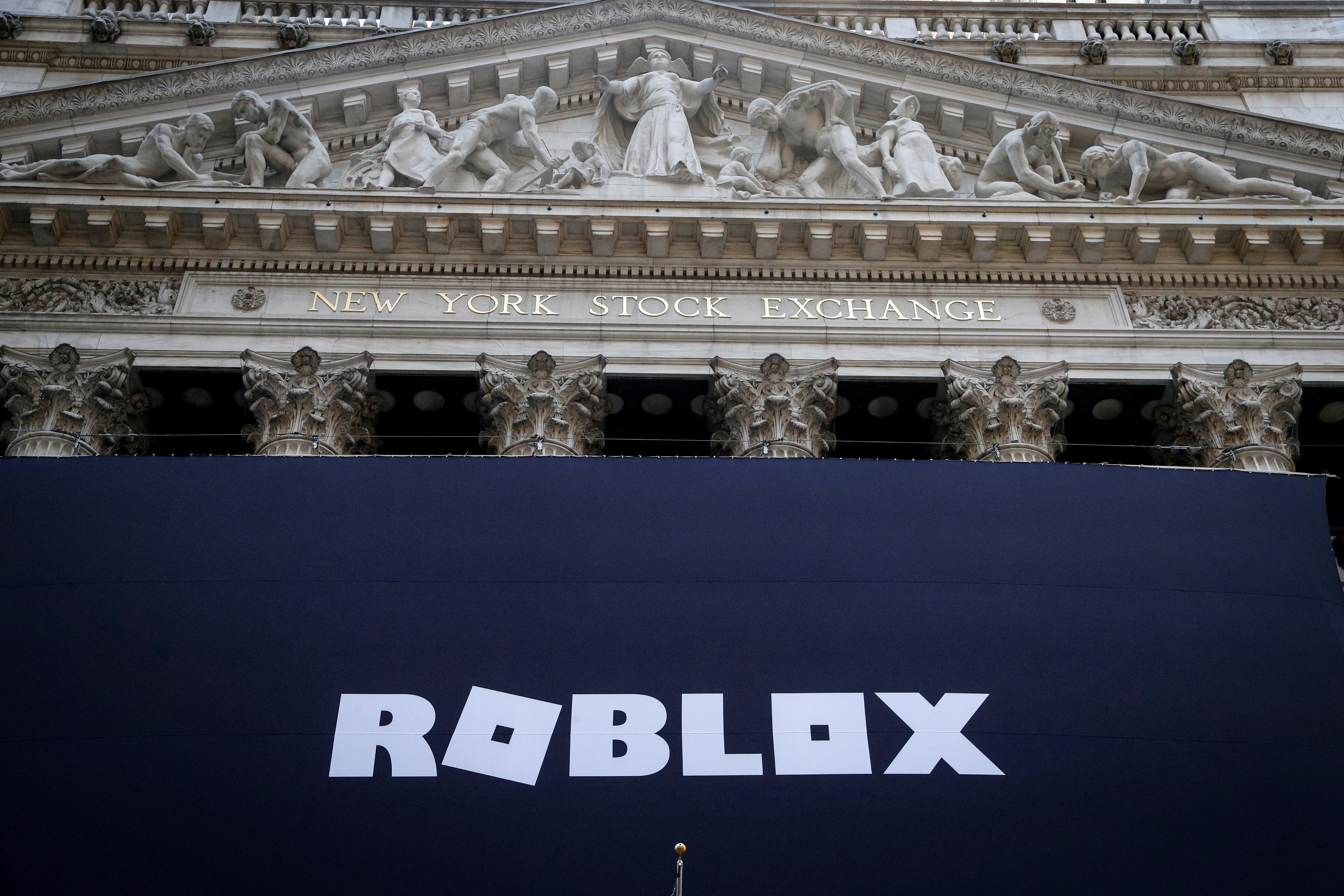 The Roblox logo is displayed on a banner, to celebrate the company's IPO, on the front facade of the New York Stock Exchange (NYSE) in New York, U.S., March 10, 2021. REUTERS/Brendan McDermid/File Photo