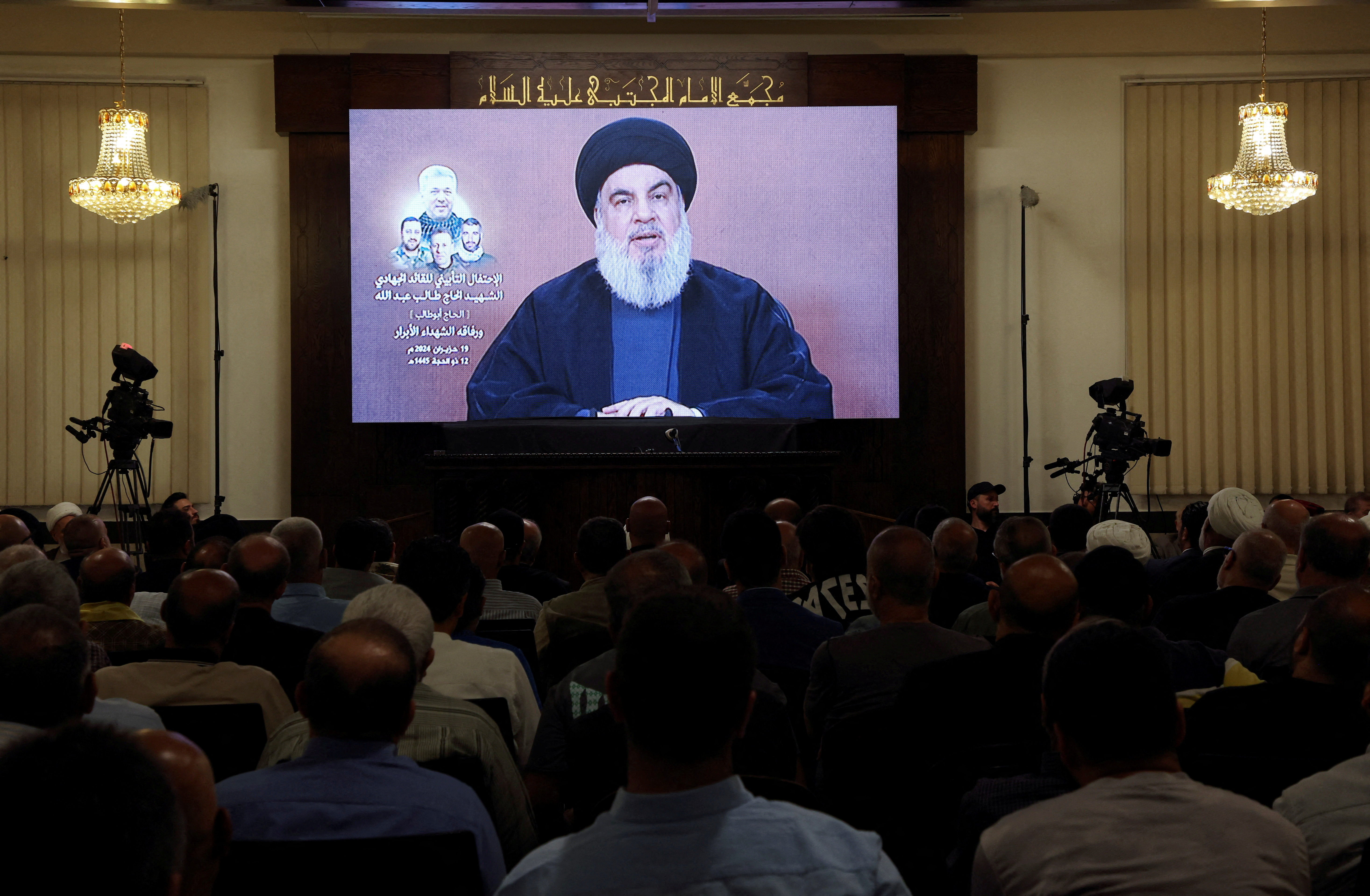 Lebanon's Hezbollah leader Sayyed Hassan Nasrallah speaks during a televised address at a memorial service in Beirut's southern suburbs