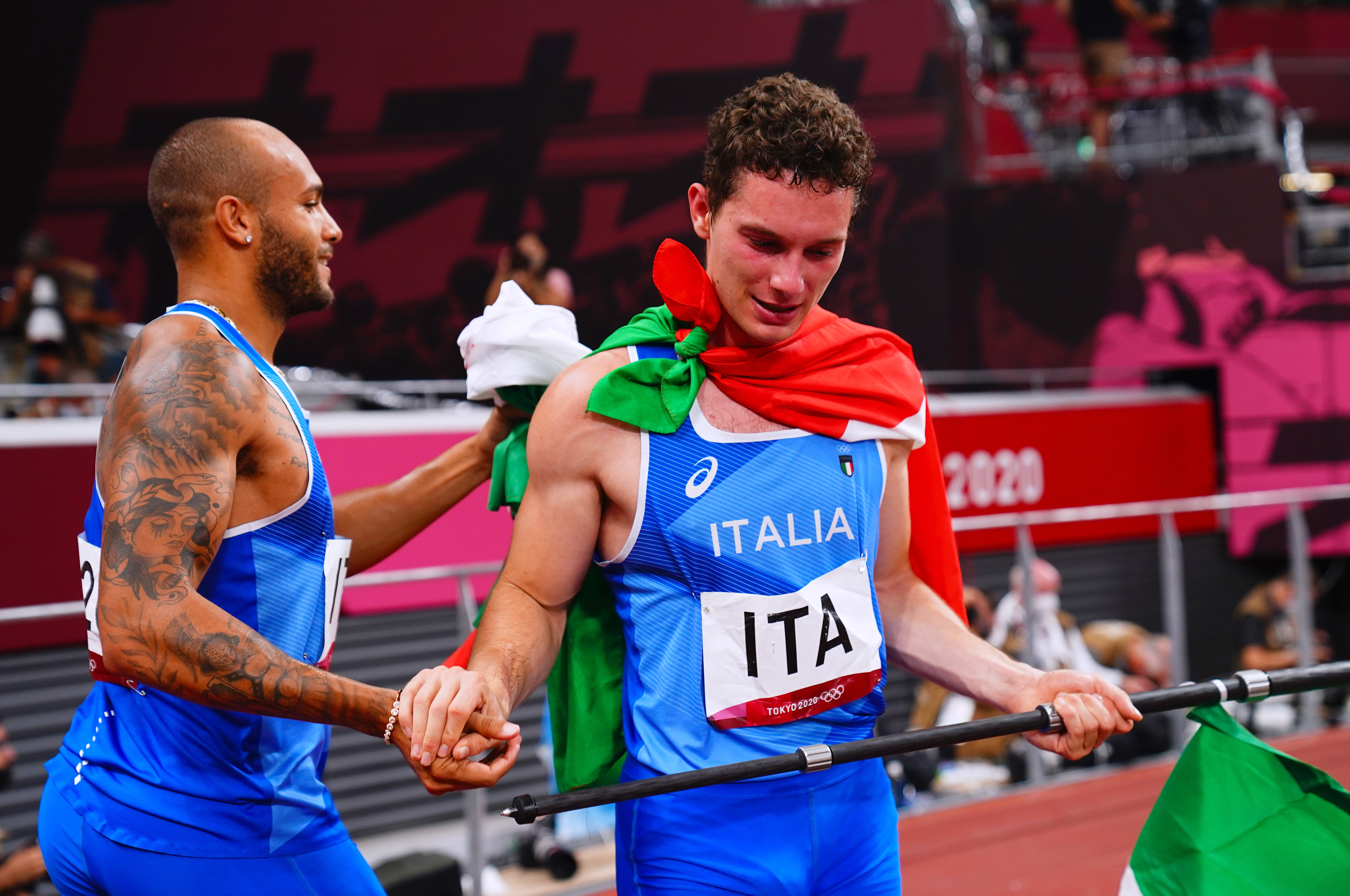 Tokyo 2020 Olympics - Athletics - Men's 4 x 100m Relay - Final - Olympic Stadium, Tokyo, Japan - August 6, 2021.  Lamont Marcell Jacobs of Italy and Filippo Tortu of Italy celebrate after winning gold REUTERS/Aleksandra Szmigiel