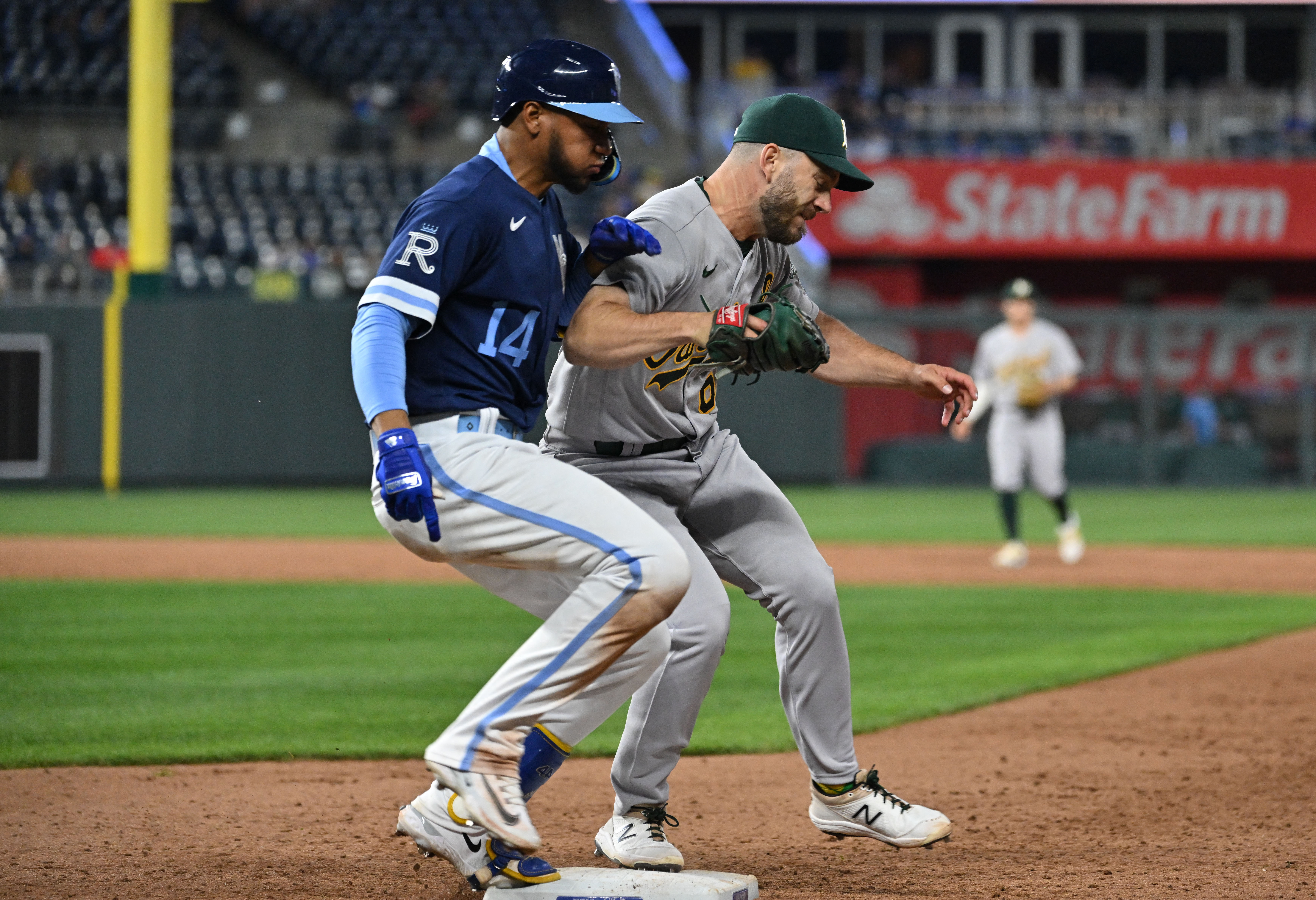 A's score big, hold off Royals' comeback bid