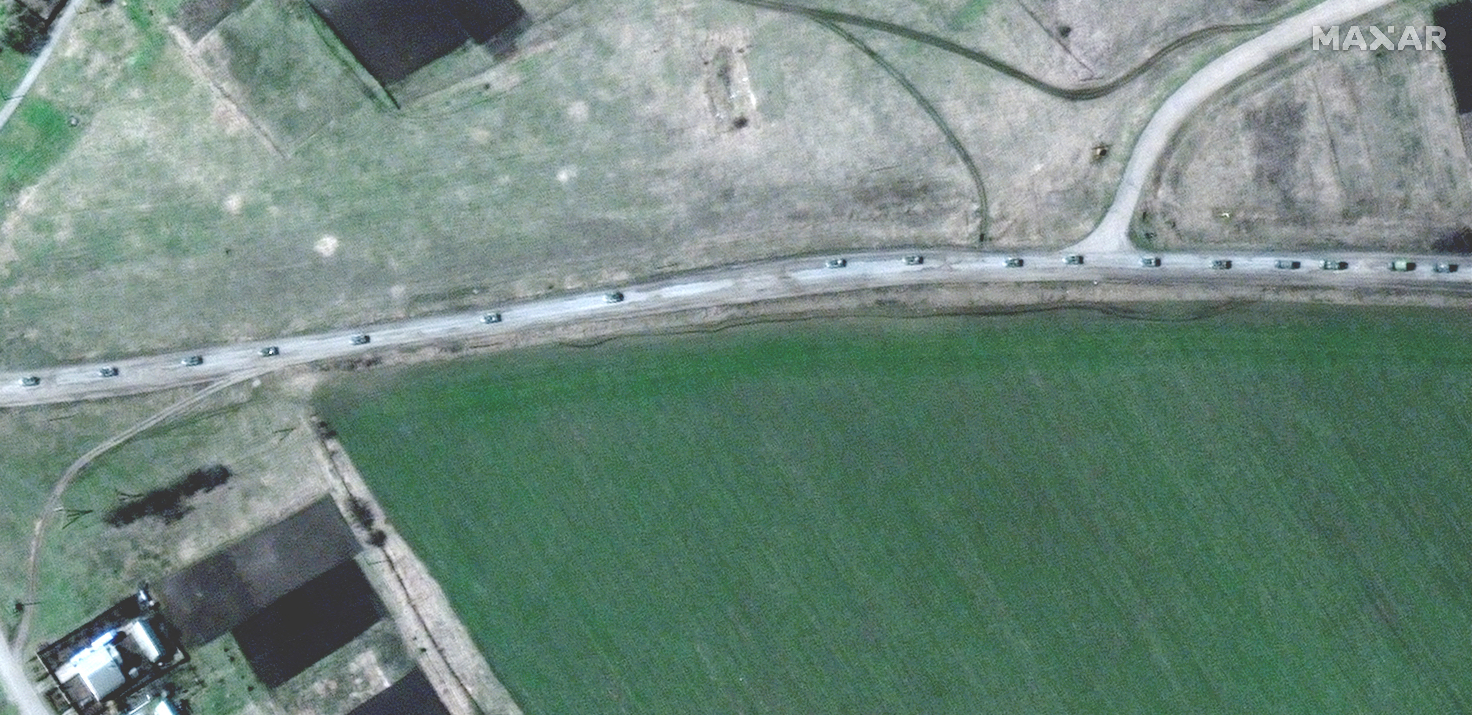 A satellite image shows convoy of military forces heading south toward Donbas region
